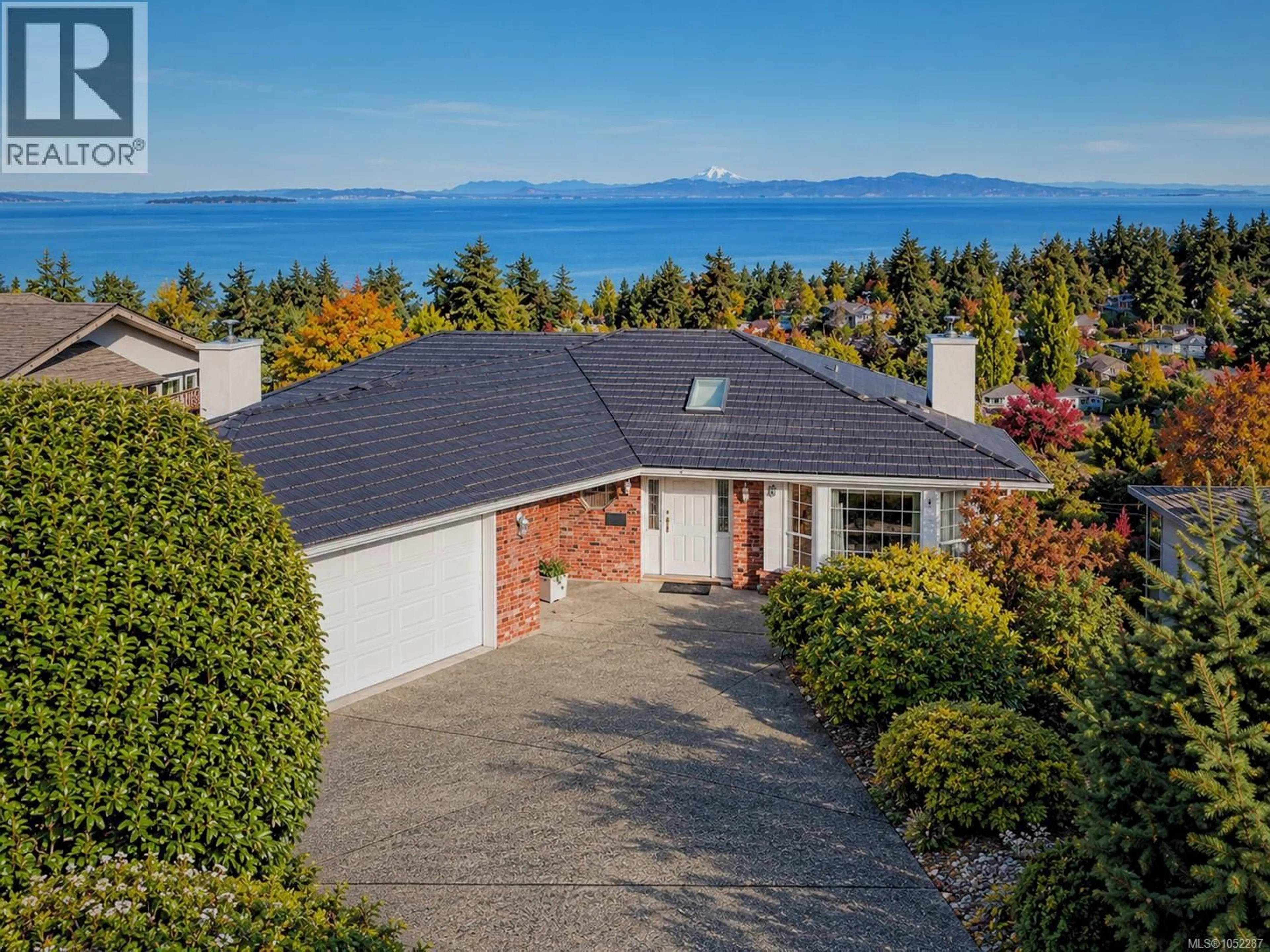 A pic from outside/outdoor area/front of a property/back of a property/a pic from drone, water/lake/river/ocean view for 974 SEAPEARL PLACE, Saanich British Columbia V8Y2X2