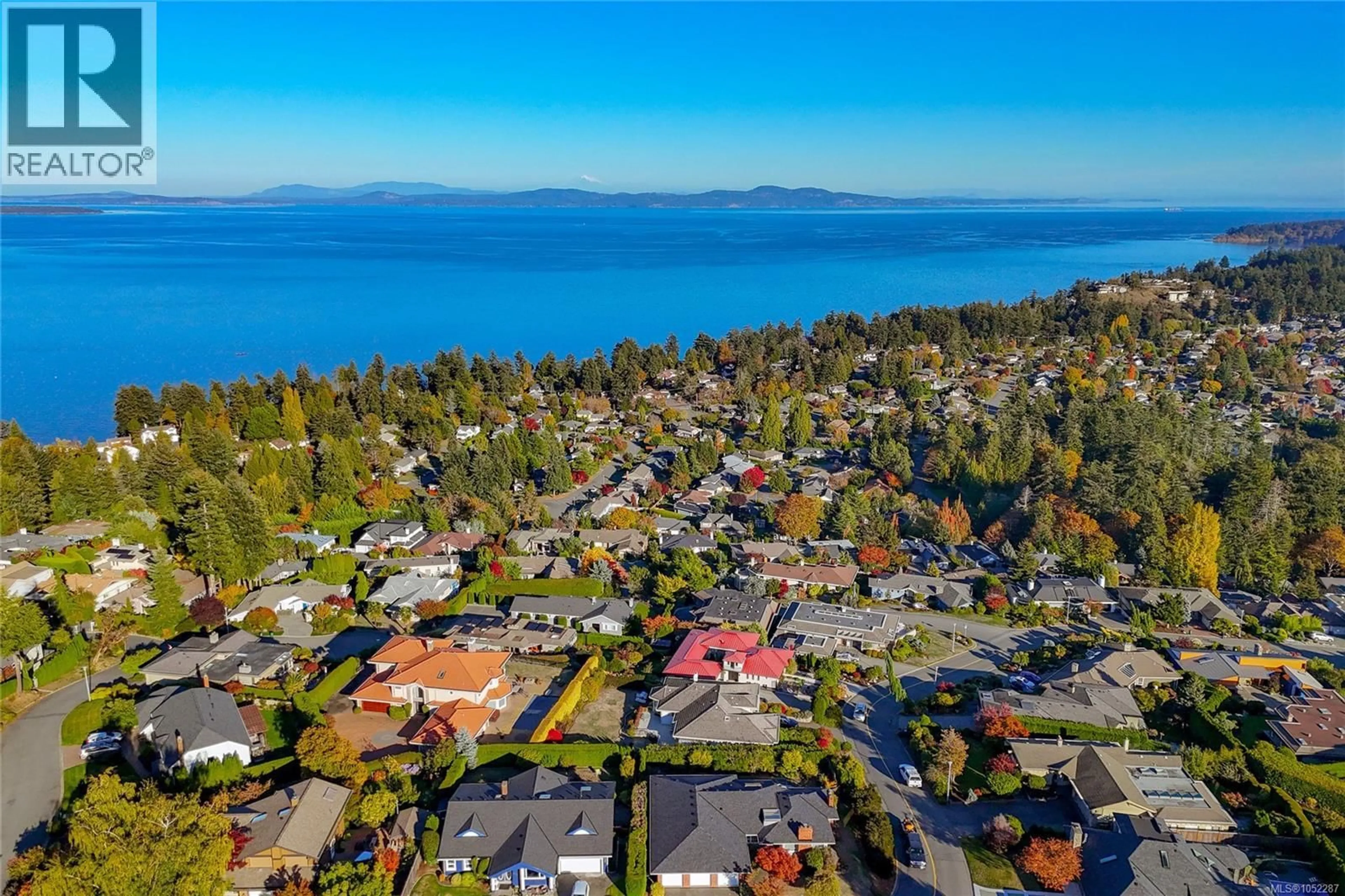 A pic from outside/outdoor area/front of a property/back of a property/a pic from drone, water/lake/river/ocean view for 974 SEAPEARL PLACE, Saanich British Columbia V8Y2X2