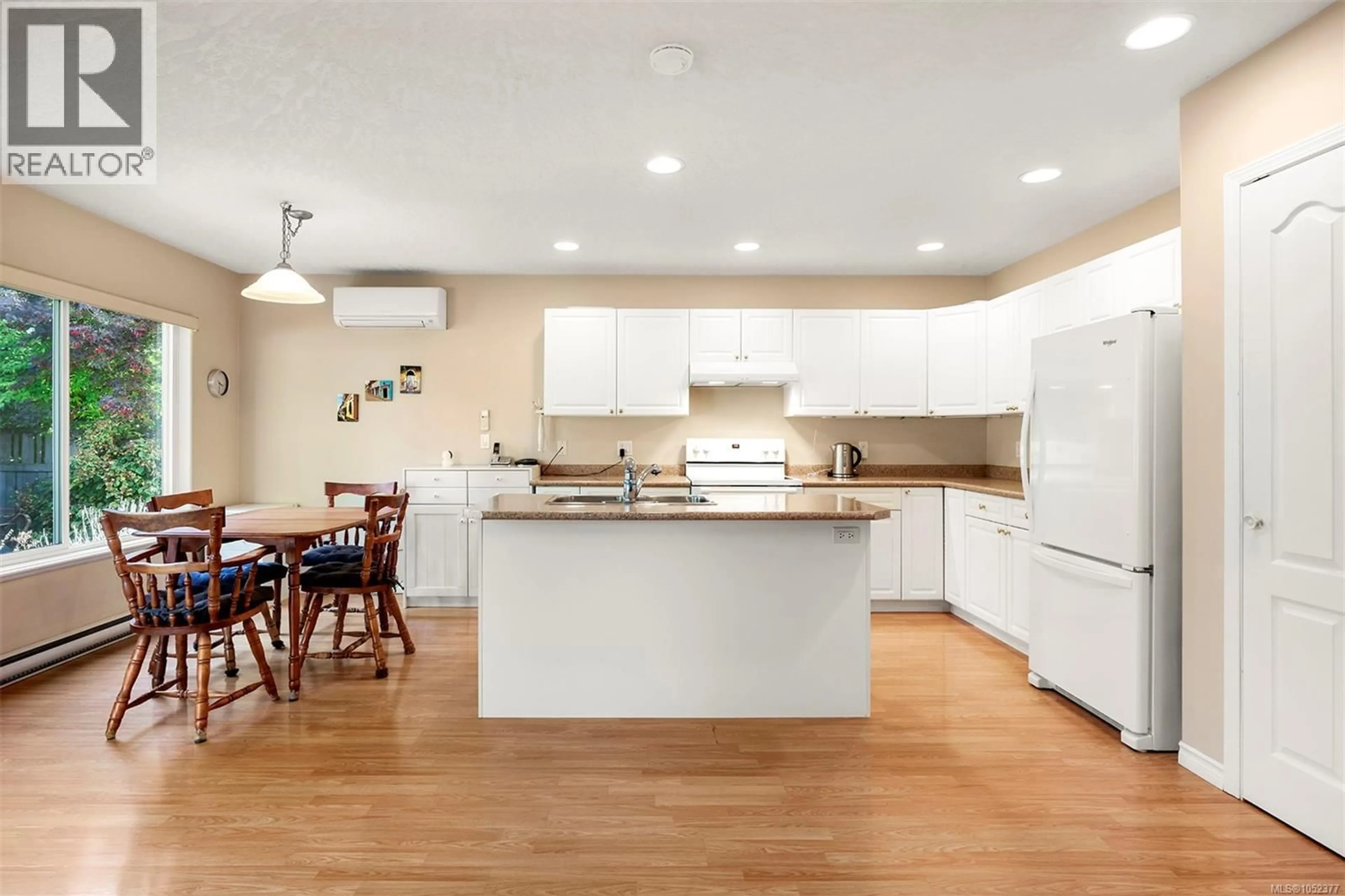 Open concept kitchen, wood/laminate floor for 642 OLYMPIC DRIVE, Comox British Columbia V9M4G8