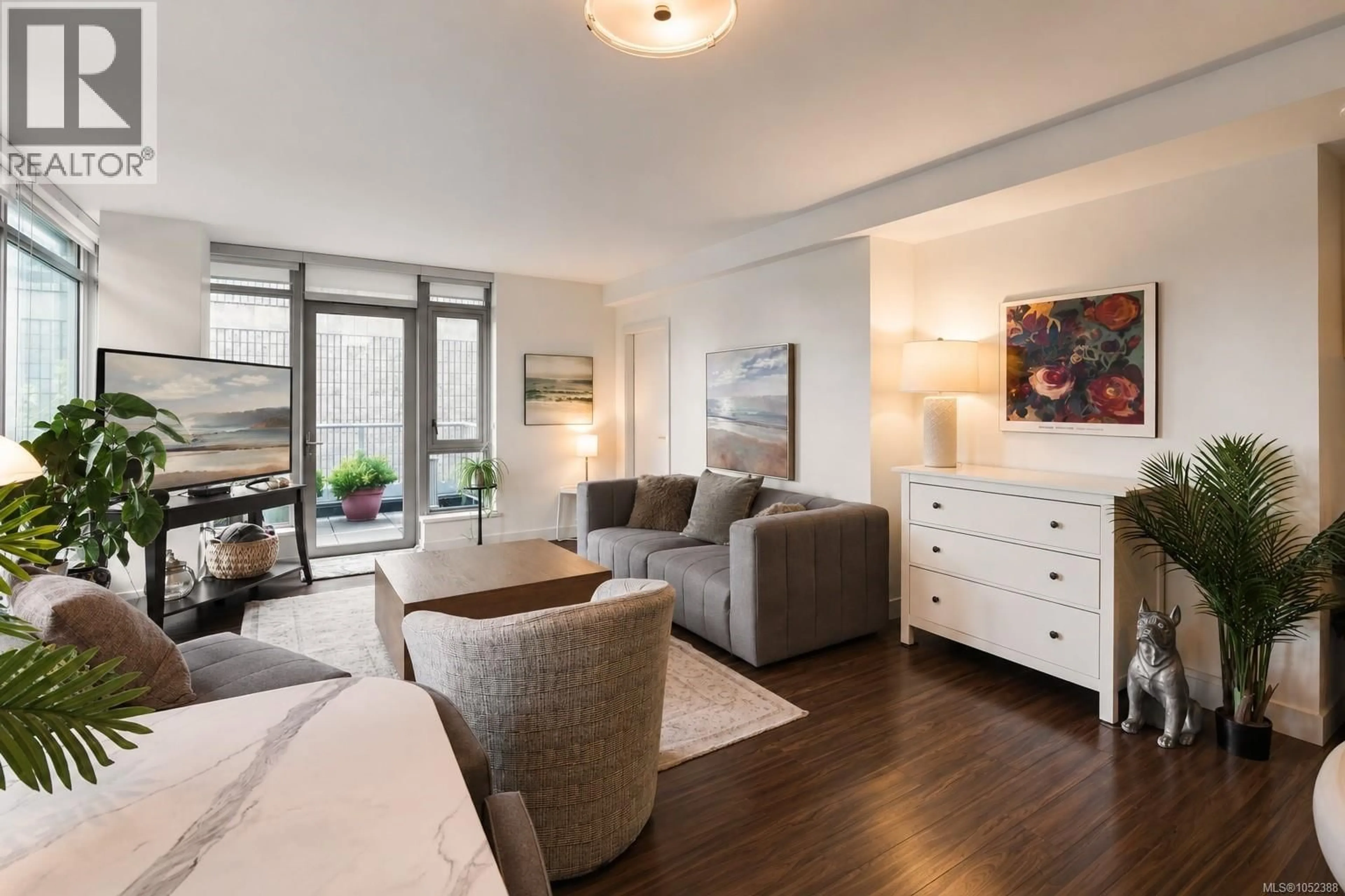 Living room with furniture, wood/laminate floor for 204 - 838 BROUGHTON STREET, Victoria British Columbia V8W1E4