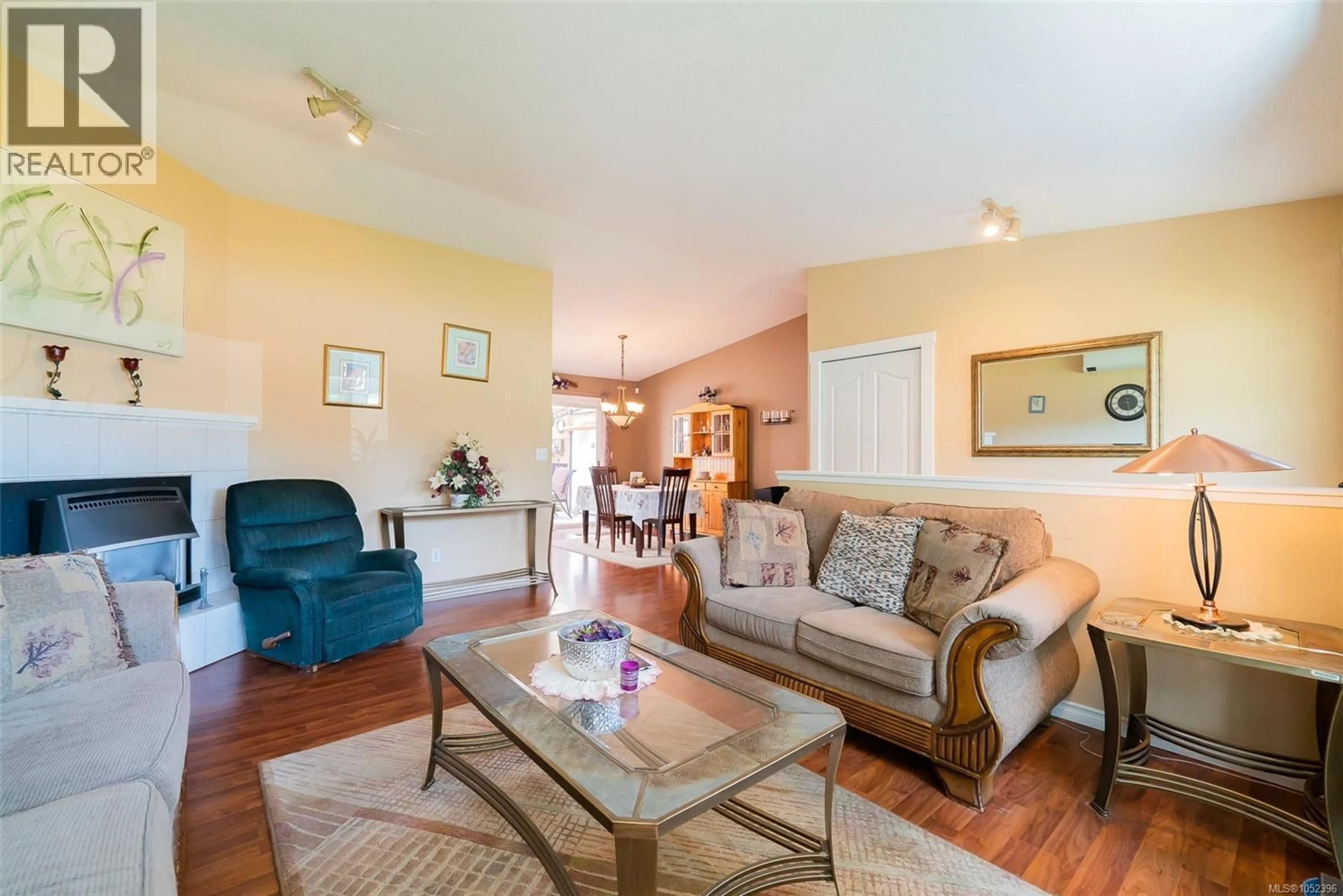 Living room with furniture, wood/laminate floor for 2446 DIVOT DRIVE, Nanaimo British Columbia V9T4B2
