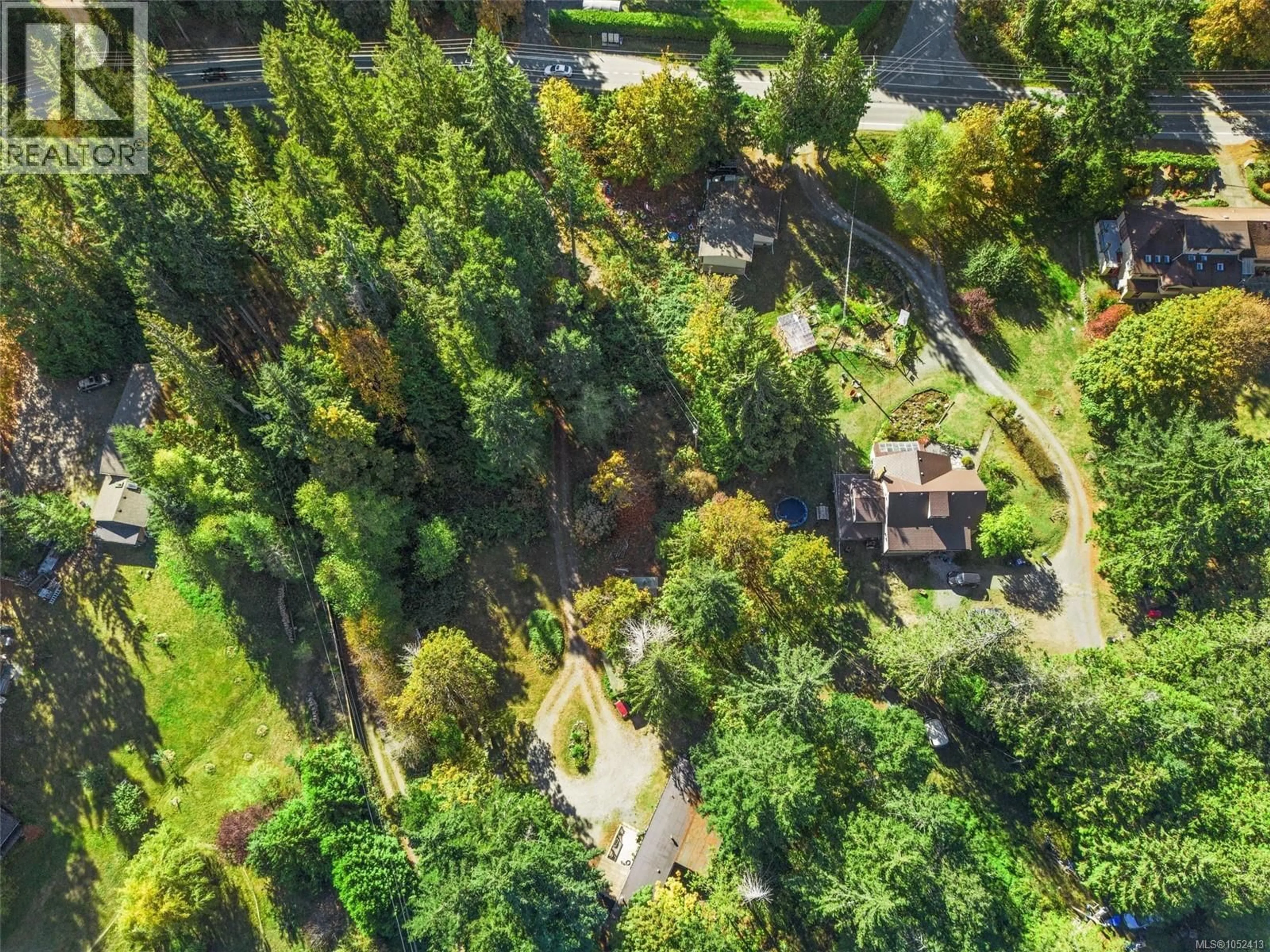 A pic from outside/outdoor area/front of a property/back of a property/a pic from drone, forest/trees view for 1549 SHAWNIGAN MILL BAY ROAD, Shawnigan Lake British Columbia V8H2A4