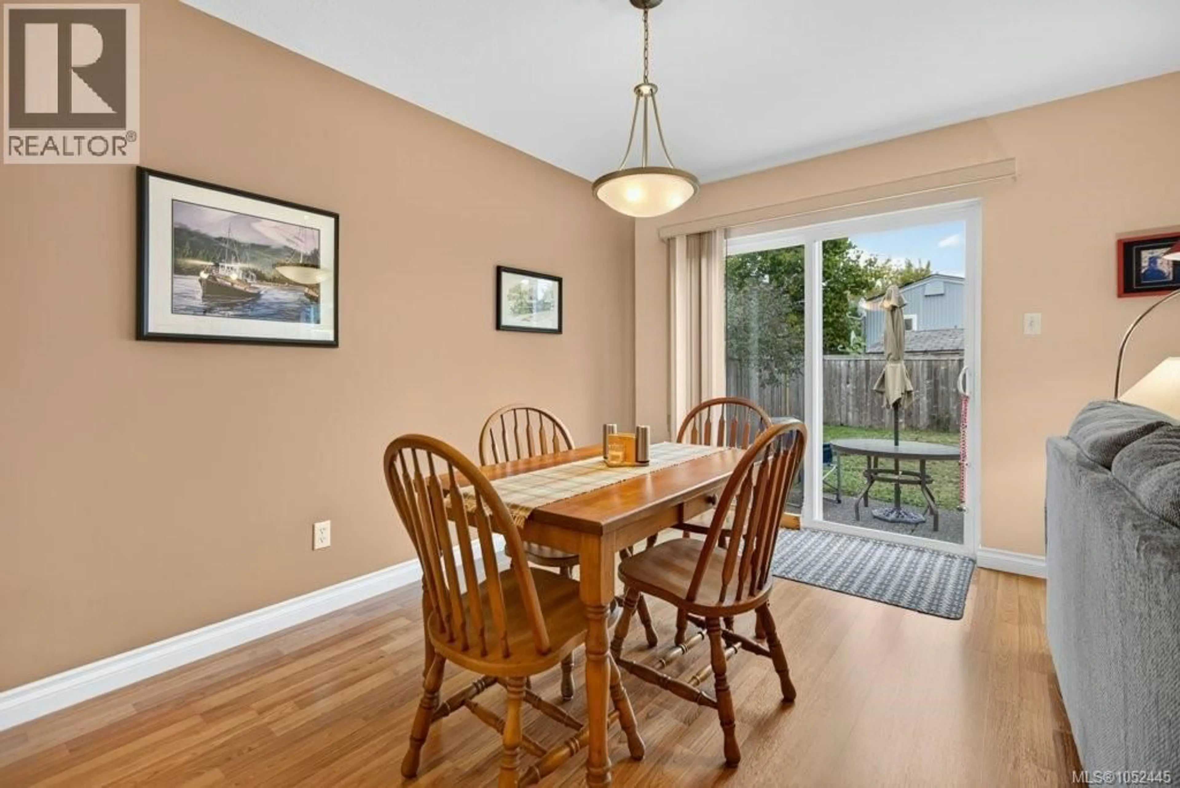 Dining room, wood/laminate floor for 3303 EIGHTH STREET, Cumberland British Columbia V0R1S0