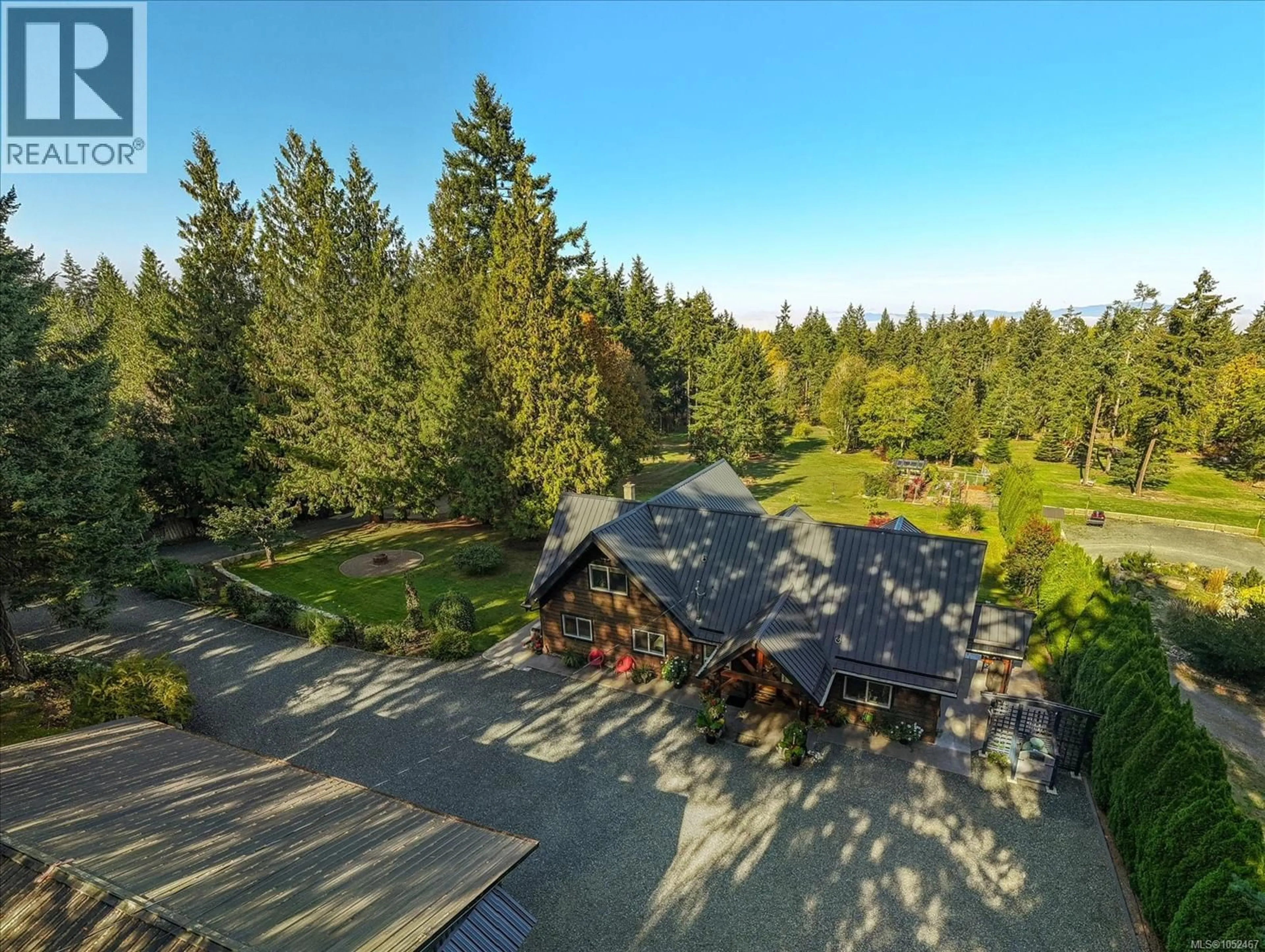 A pic from outside/outdoor area/front of a property/back of a property/a pic from drone, forest/trees view for 521 FOURNEAU WAY, Parksville British Columbia V9P2J7