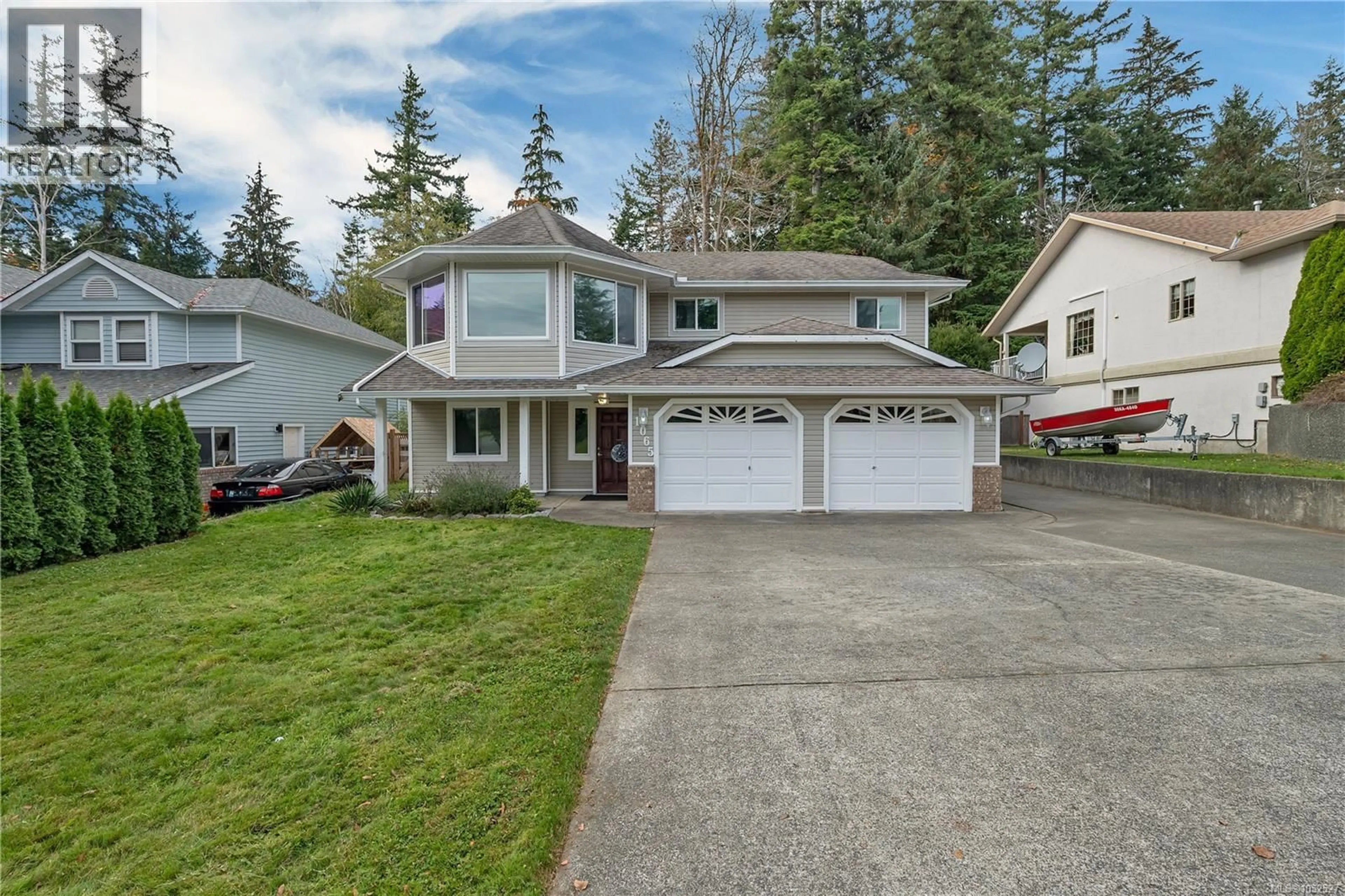 Home with vinyl exterior material, street for 1065 SPRINGBOK ROAD, Campbell River British Columbia V9W7K7
