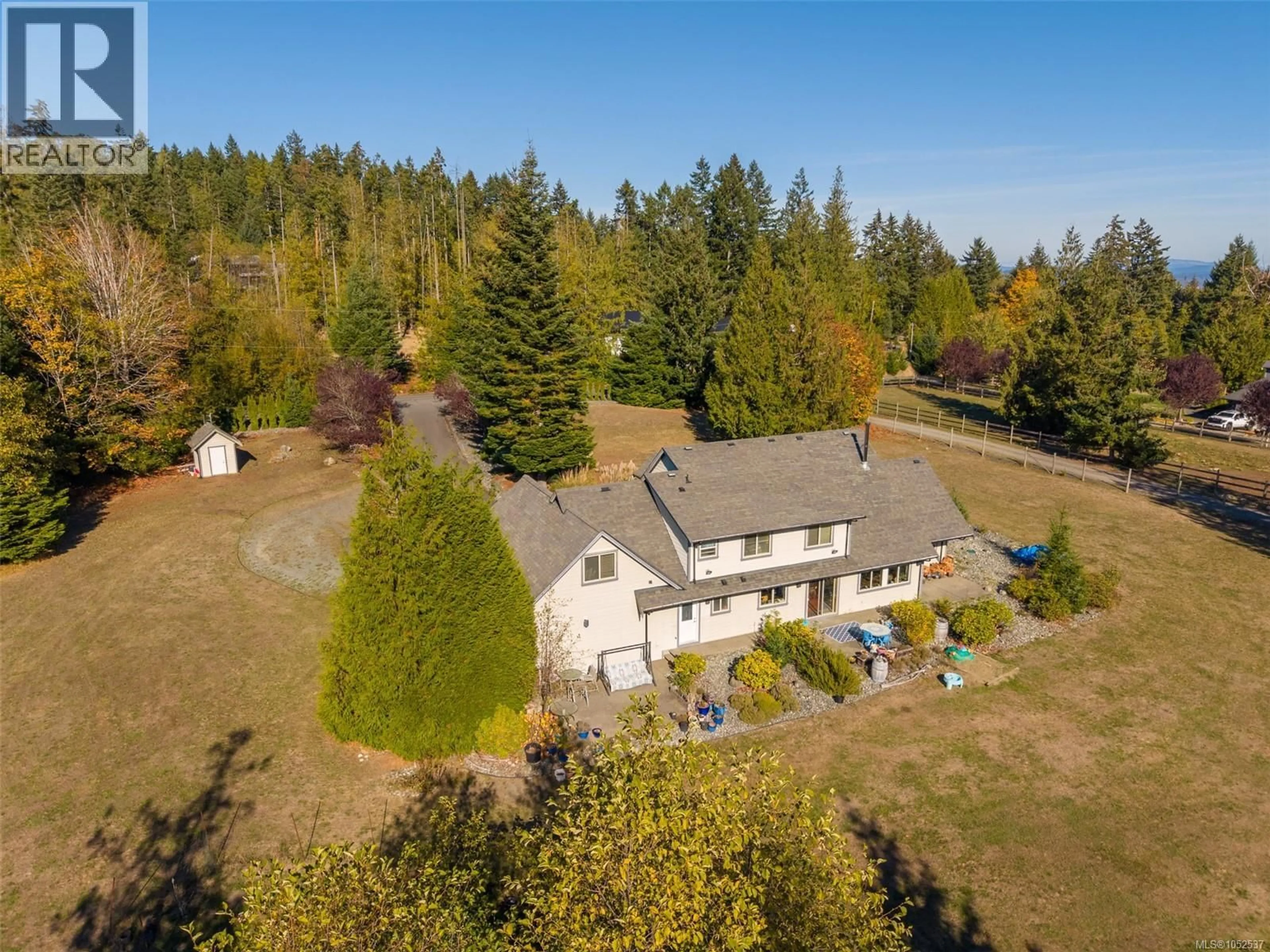 A pic from outside/outdoor area/front of a property/back of a property/a pic from drone, forest/trees view for 762 MEMORY LANE, Mill Bay British Columbia V0R2P4
