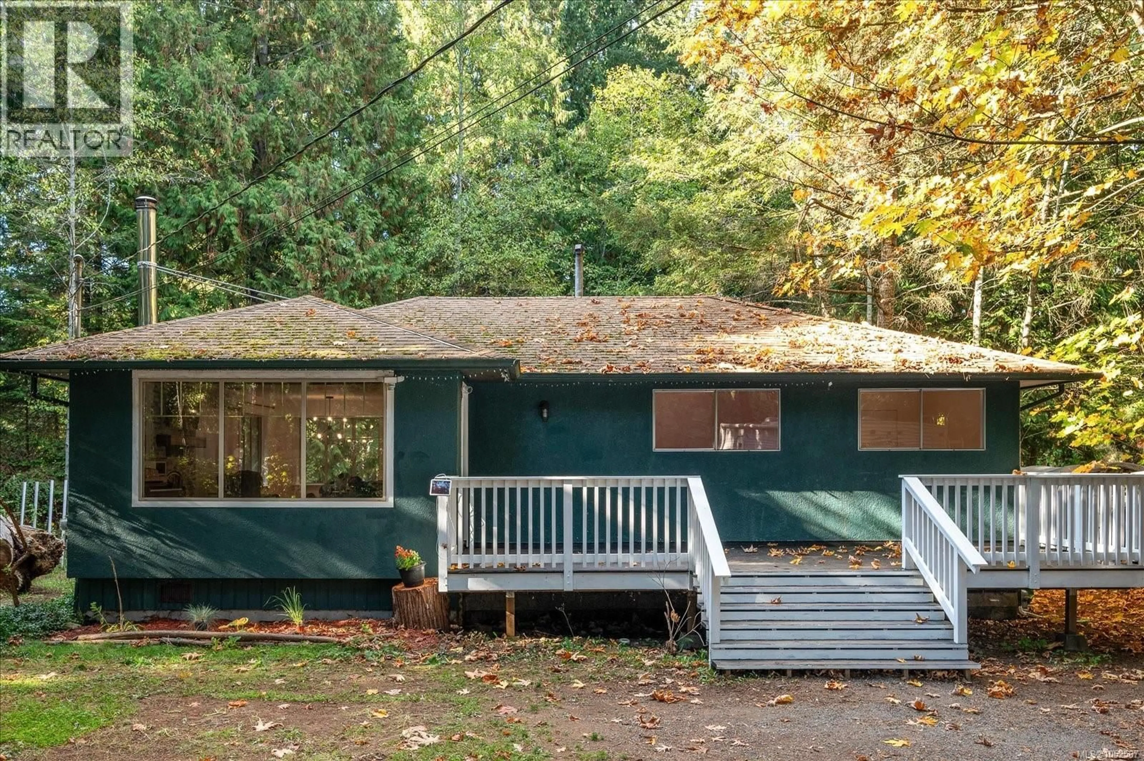 Home with vinyl exterior material, forest/trees view for 705 CARR BOULEVARD, Gabriola Island British Columbia V0R1X3