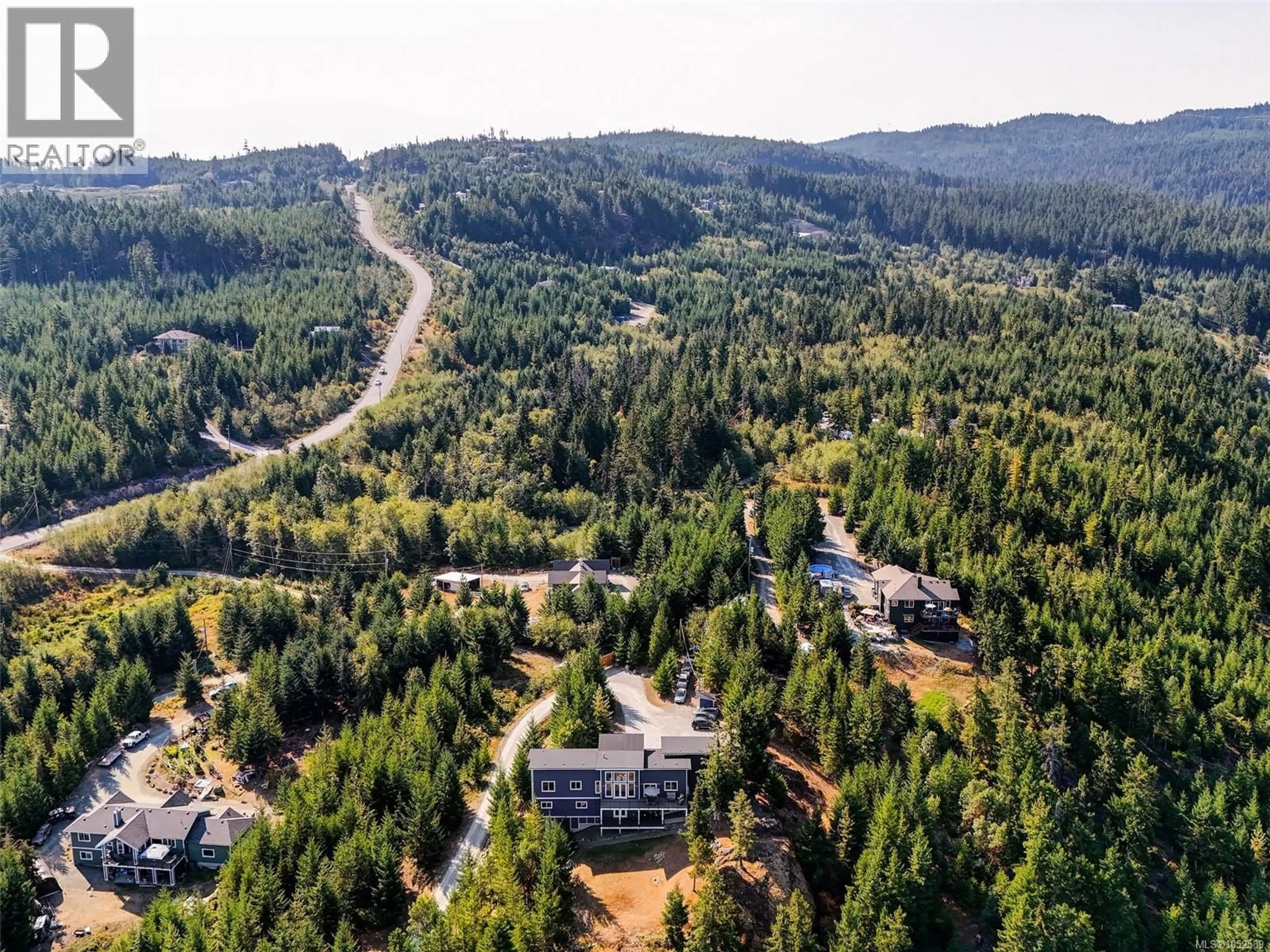 A pic from outside/outdoor area/front of a property/back of a property/a pic from drone, forest/trees view for 4836 GOLDSTREAM HEIGHTS DRIVE, Shawnigan Lake British Columbia V8H2J1