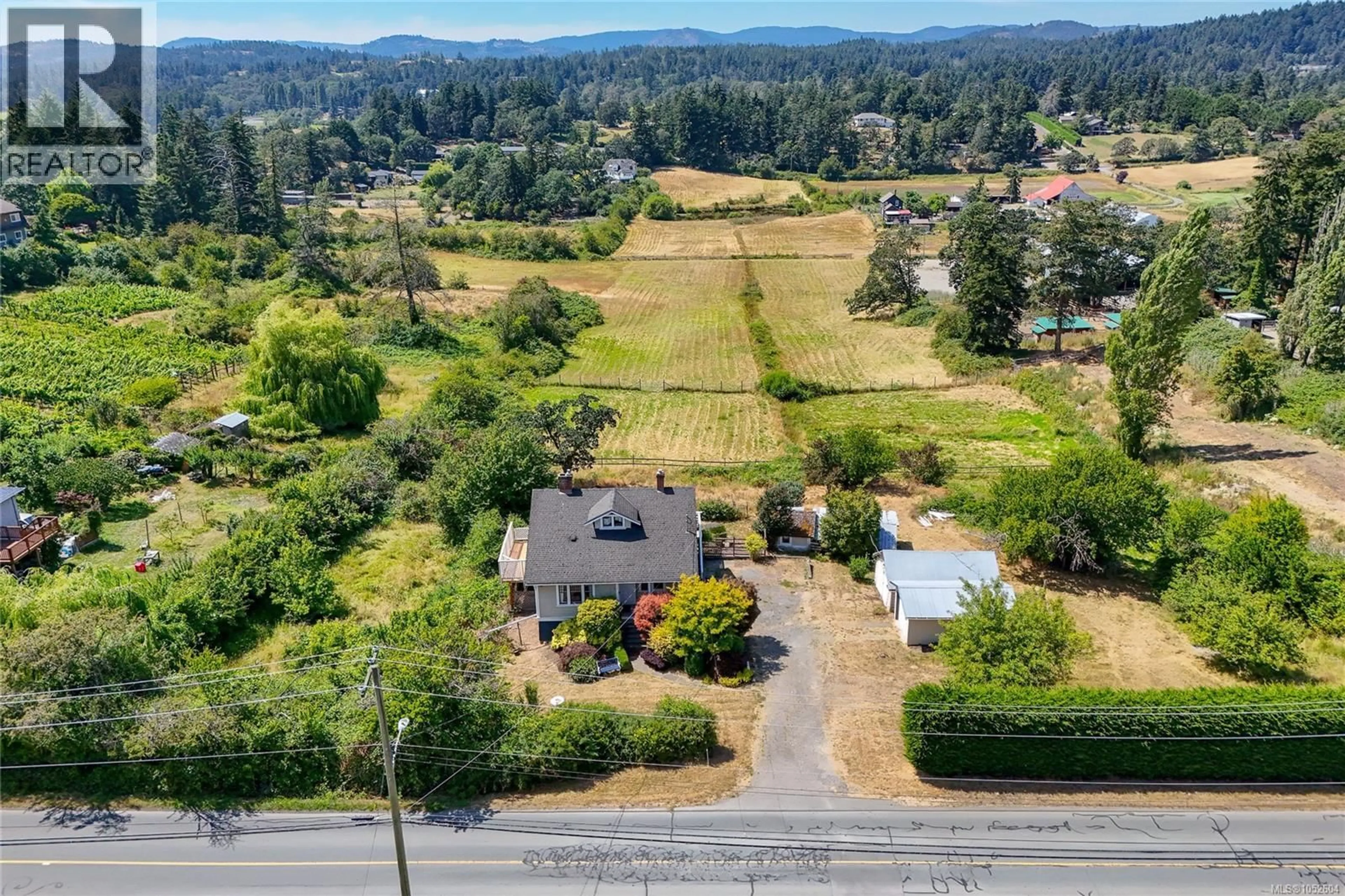 A pic from outside/outdoor area/front of a property/back of a property/a pic from drone, mountain view for 4014 HOLLAND AVENUE, Saanich British Columbia V8Z5K1