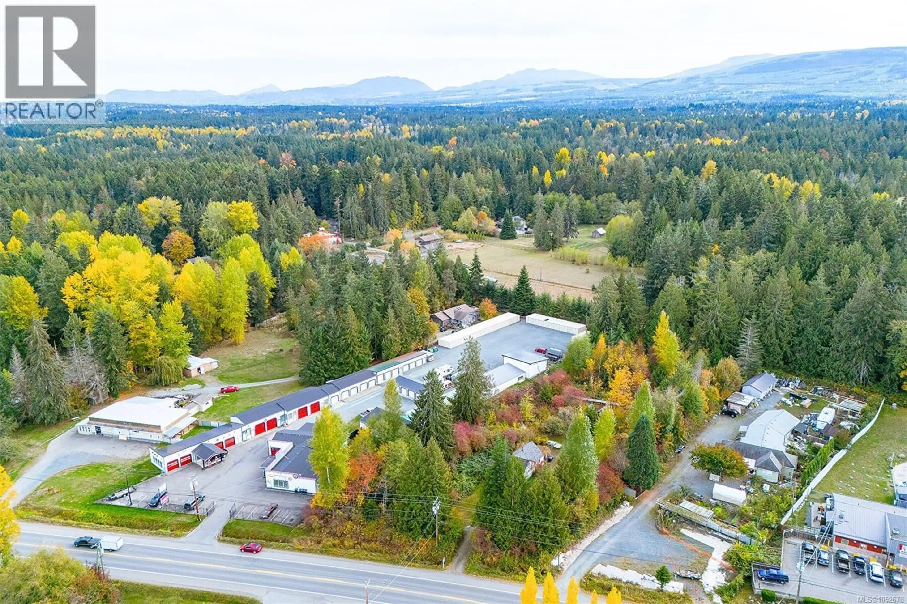 A pic from outside/outdoor area/front of a property/back of a property/a pic from drone, mountain view for 2470 ALBERNI HIGHWAY EAST, Coombs British Columbia V0R1M0