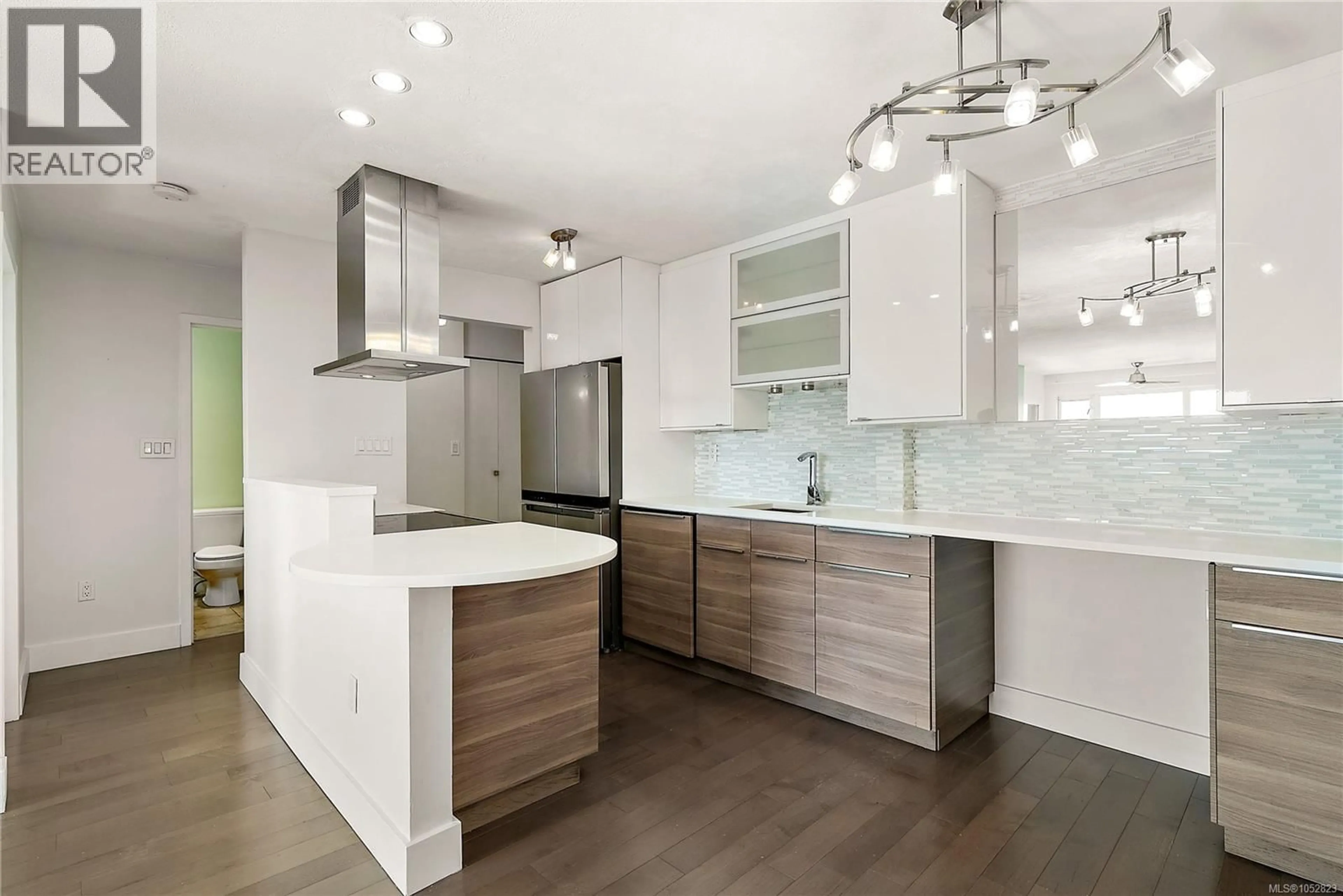 Open concept kitchen, wood/laminate floor for 802 - 105 GORGE ROAD EAST, Victoria British Columbia V9A6Z3