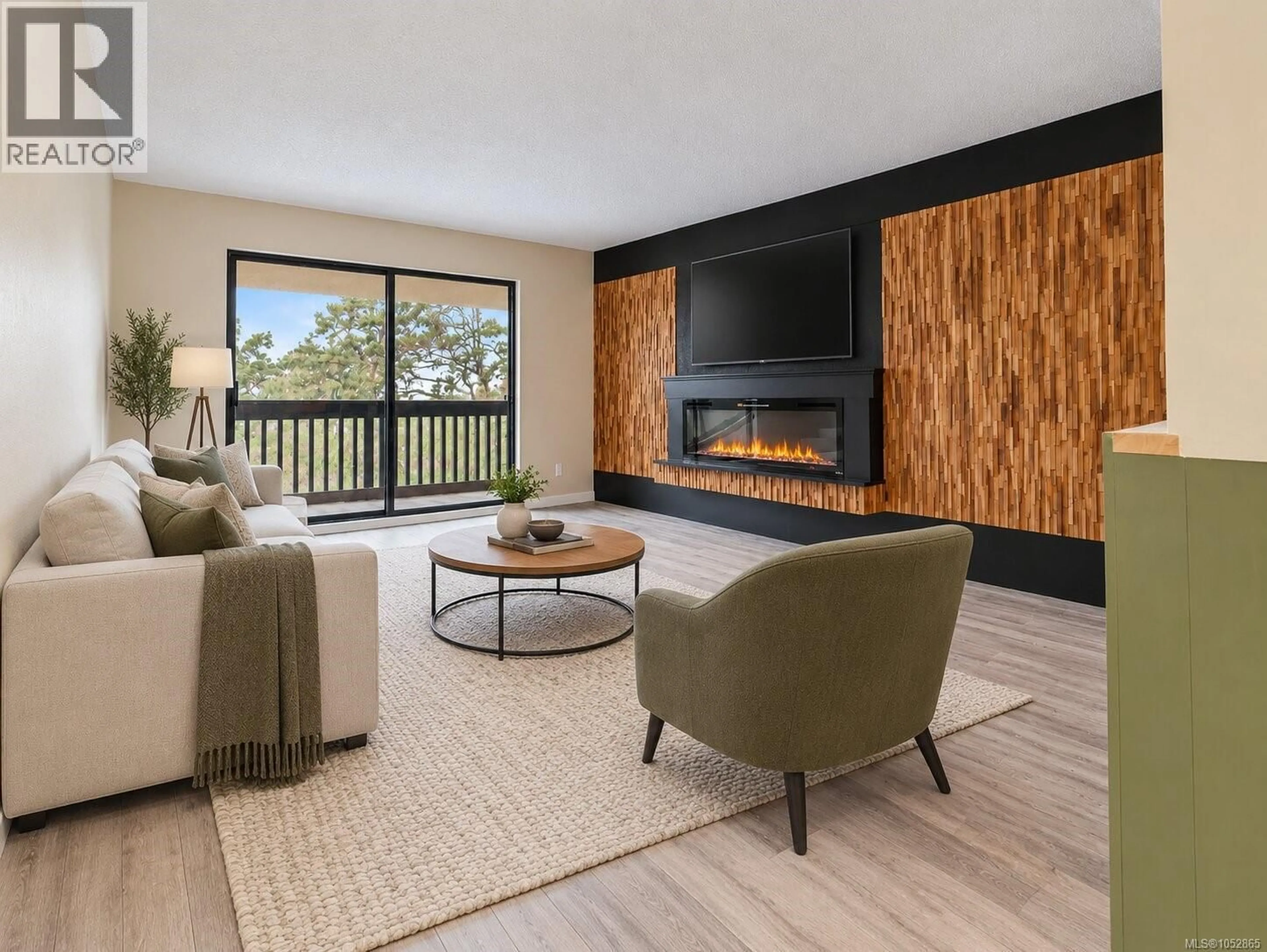 Living room with furniture, wood/laminate floor for 411 - 3277 GLASGOW AVENUE, Saanich British Columbia V8X1M3