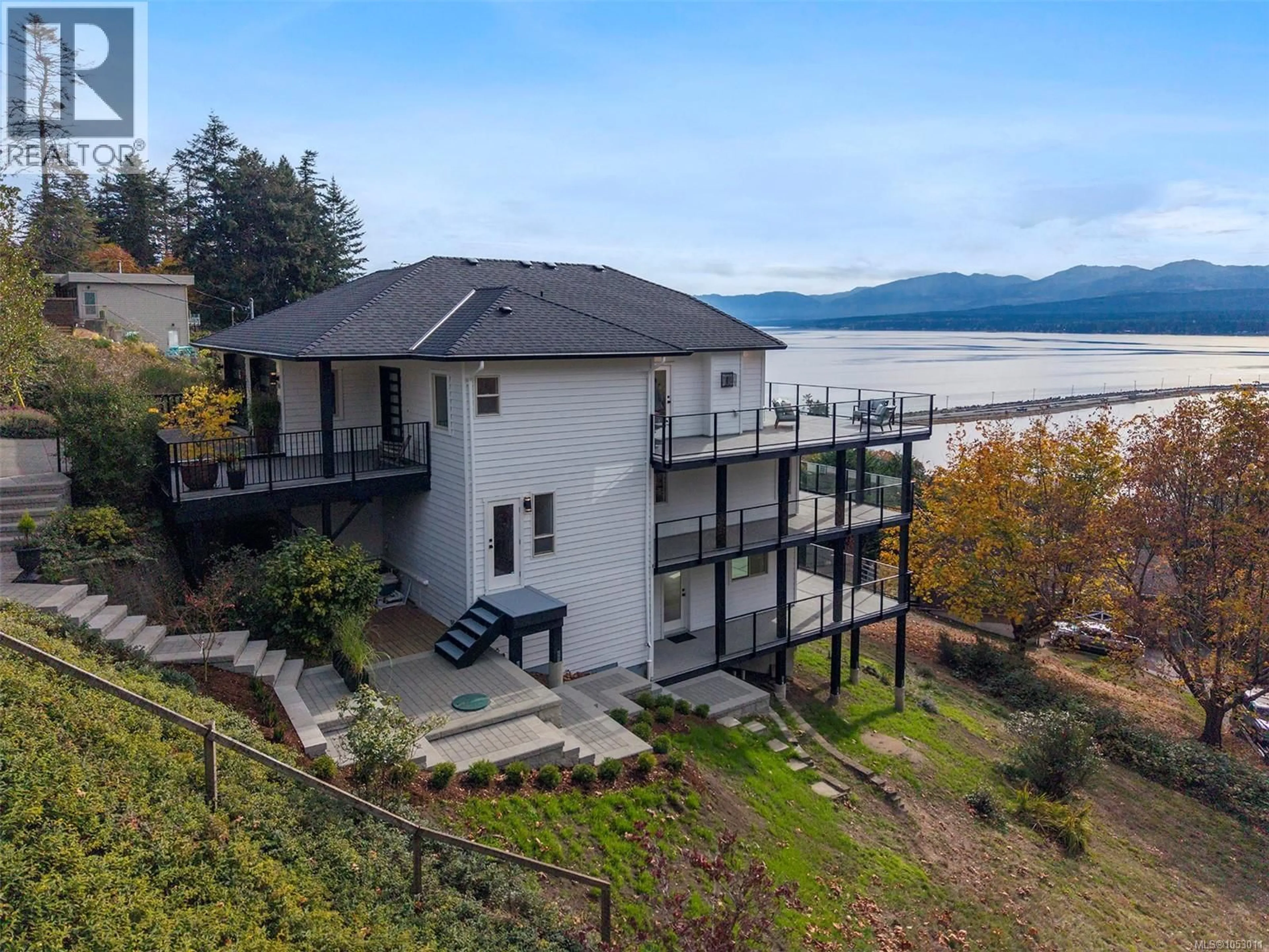 A pic from outside/outdoor area/front of a property/back of a property/a pic from drone, water/lake/river/ocean view for 1161 MOORE ROAD, Comox British Columbia V9M3X1