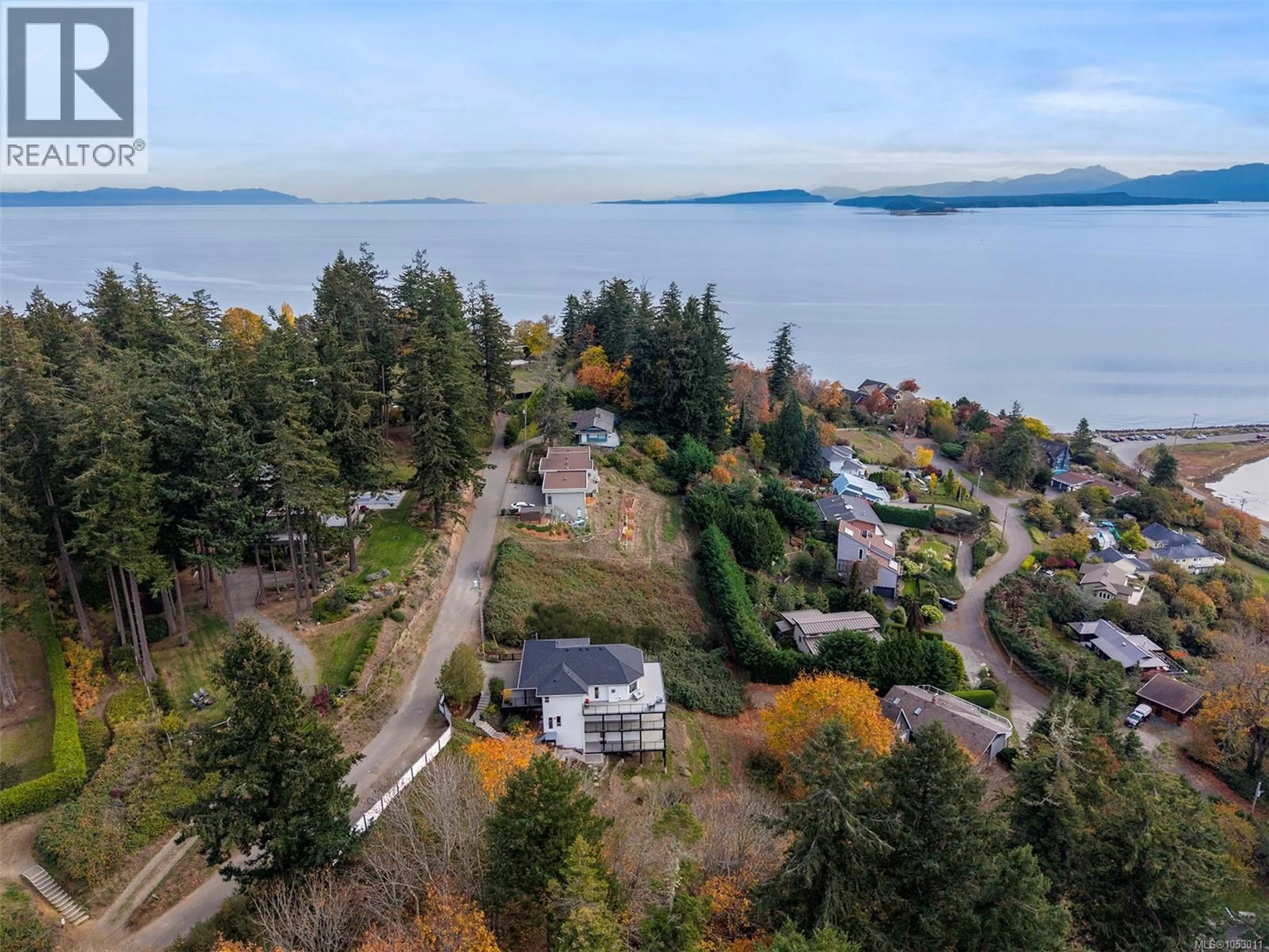 A pic from outside/outdoor area/front of a property/back of a property/a pic from drone, water/lake/river/ocean view for 1161 MOORE ROAD, Comox British Columbia V9M3X1