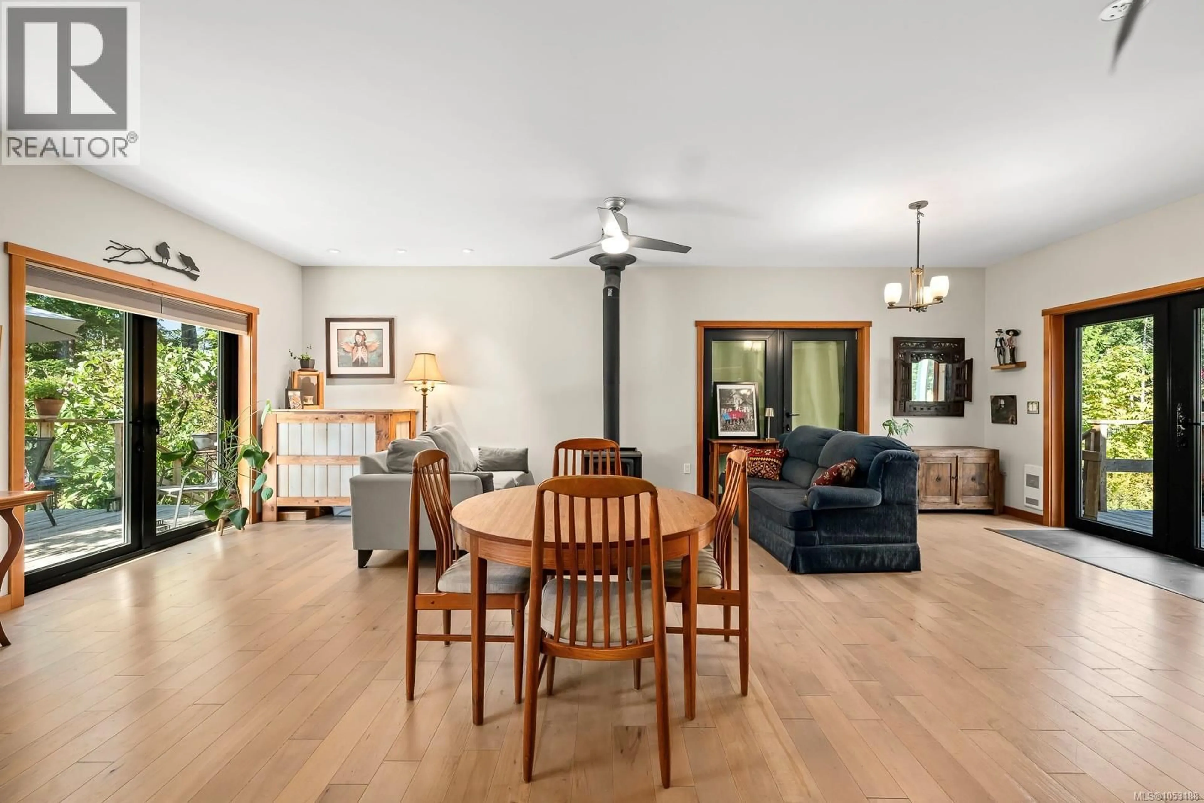 Living room with furniture, wood/laminate floor for 10225 GREENHILL ROAD, Denman Island British Columbia V0R1T0