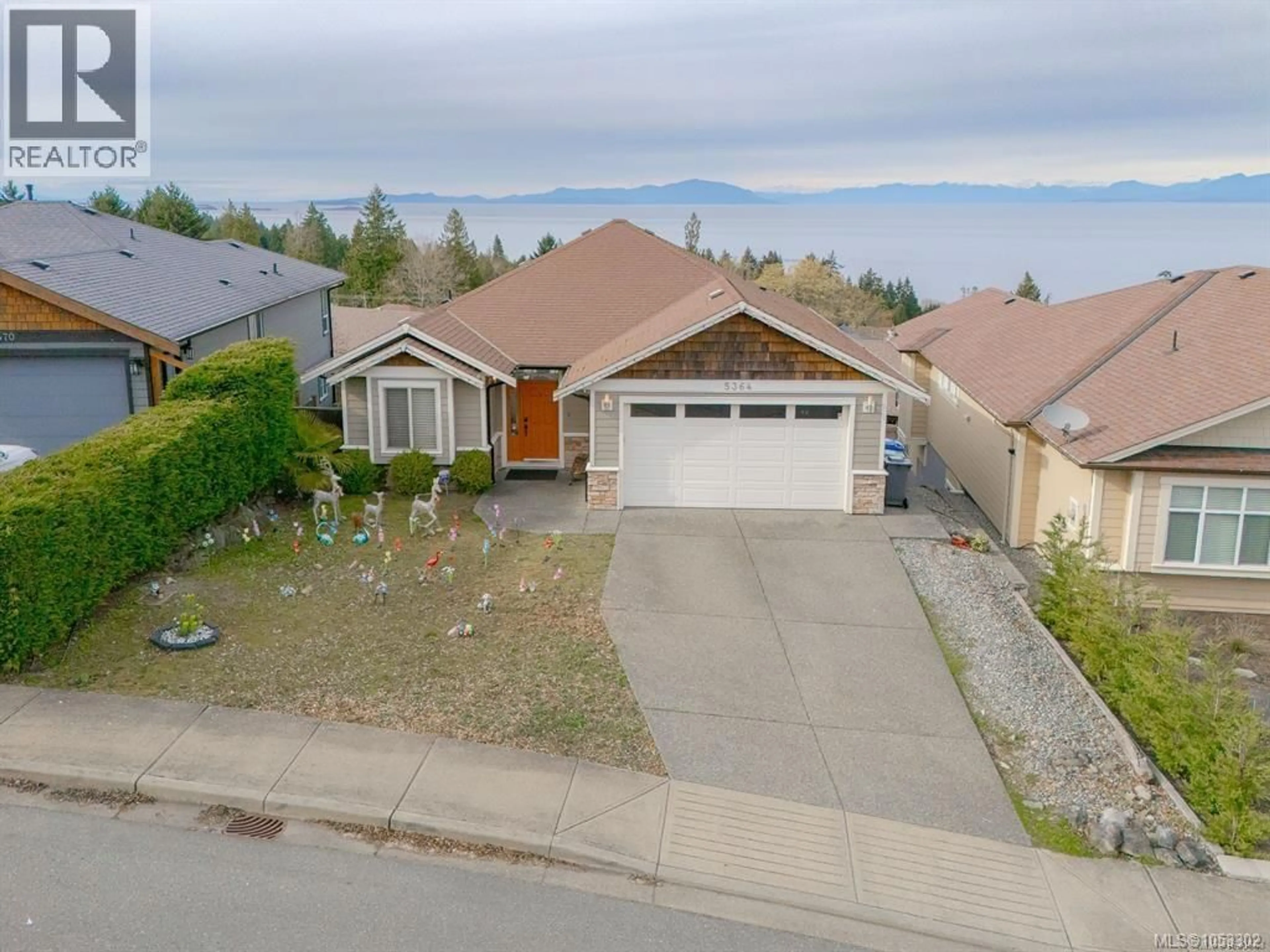 A pic from outside/outdoor area/front of a property/back of a property/a pic from drone, street for 5364 LAGUNA WAY, Nanaimo British Columbia V9T0B8