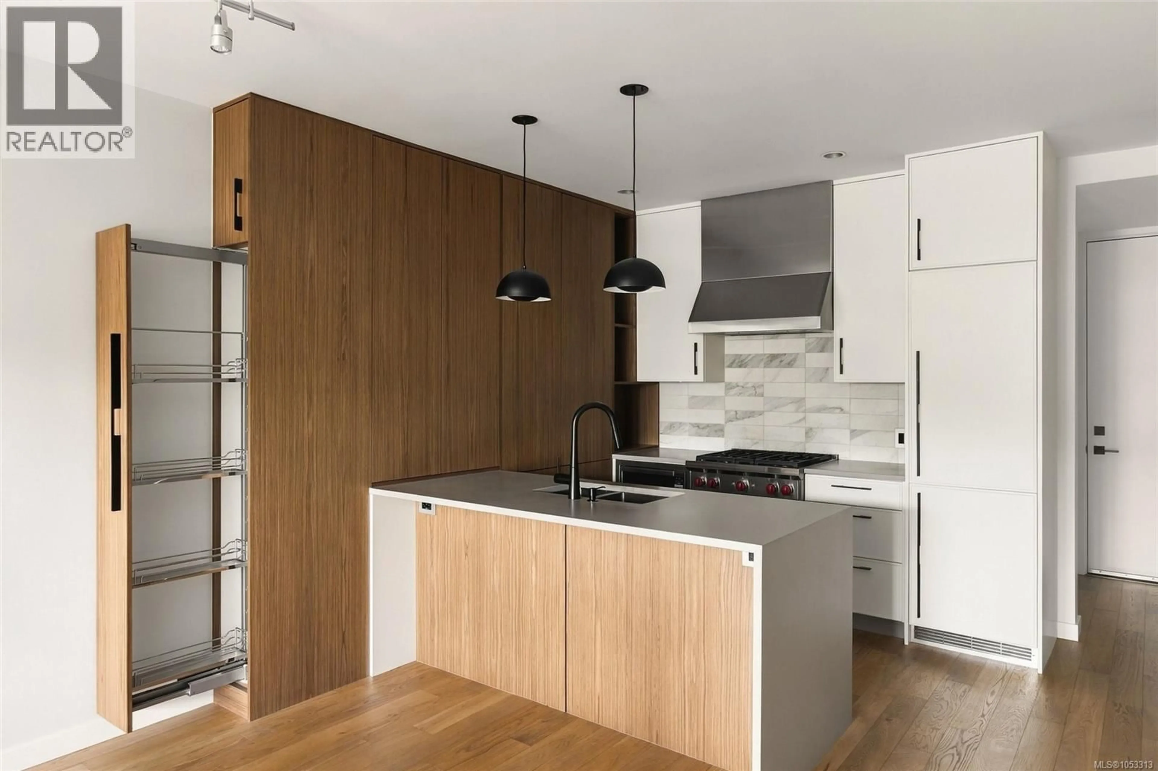 Contemporary kitchen, wood/laminate floor for 207 - 1018 PENTRELEW PLACE, Victoria British Columbia V8V4J4