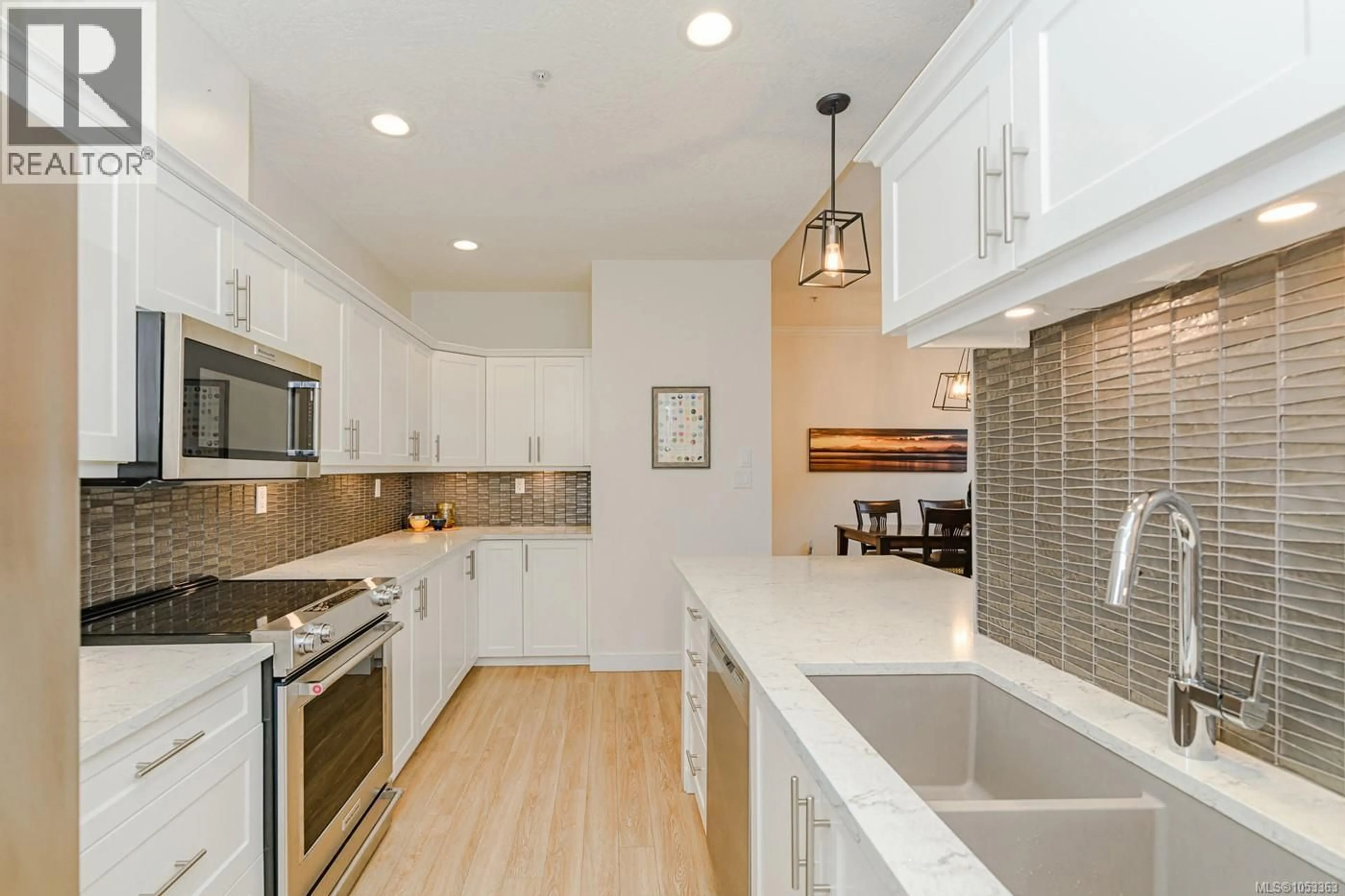 Open concept kitchen, ceramic/tile floor for 403 - 380 WATERFRONT CRESCENT, Victoria British Columbia V8T5K3