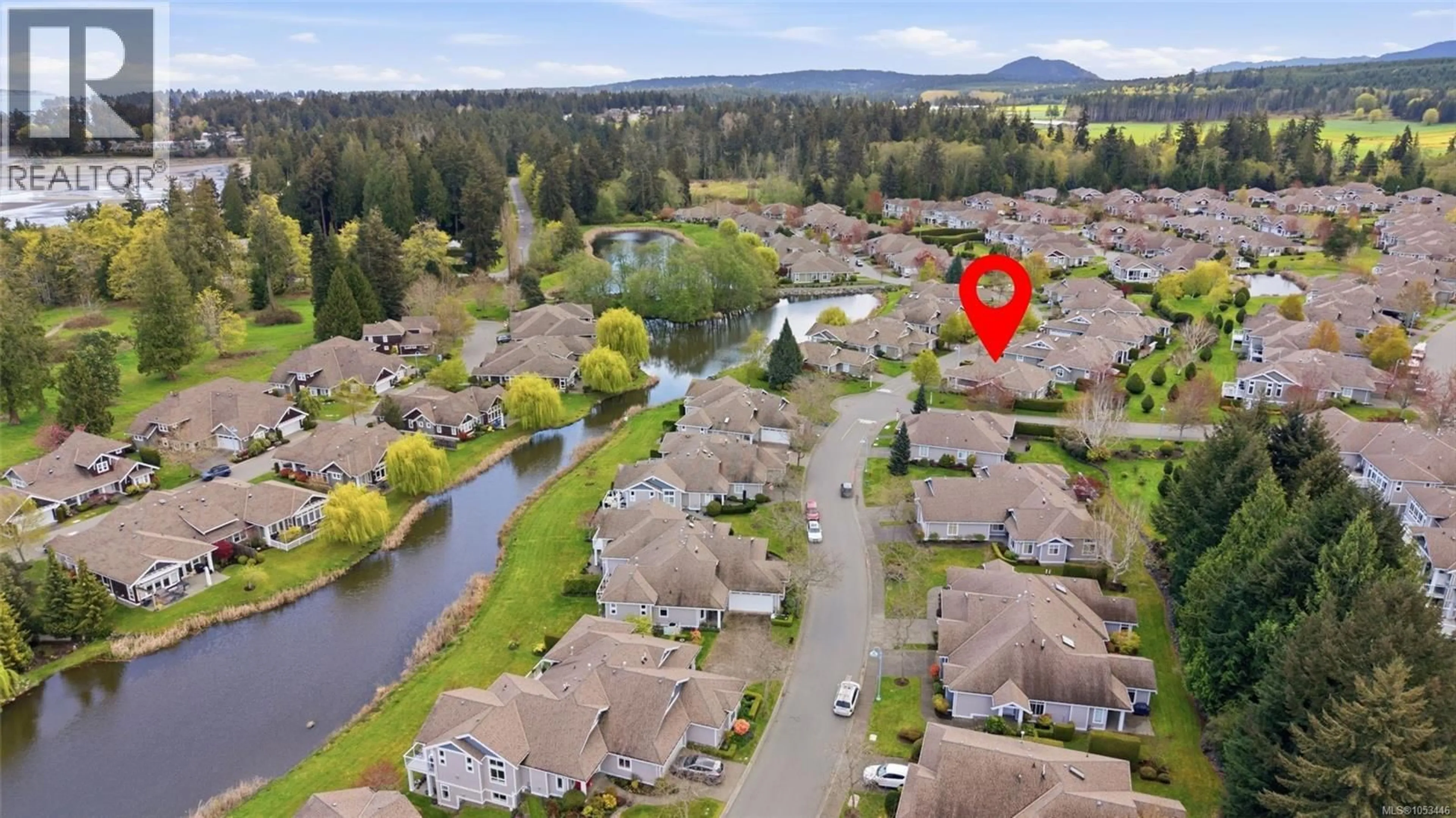 A pic from outside/outdoor area/front of a property/back of a property/a pic from drone, water/lake/river/ocean view for 1372 SATURNA DRIVE, Parksville British Columbia V9P2X9
