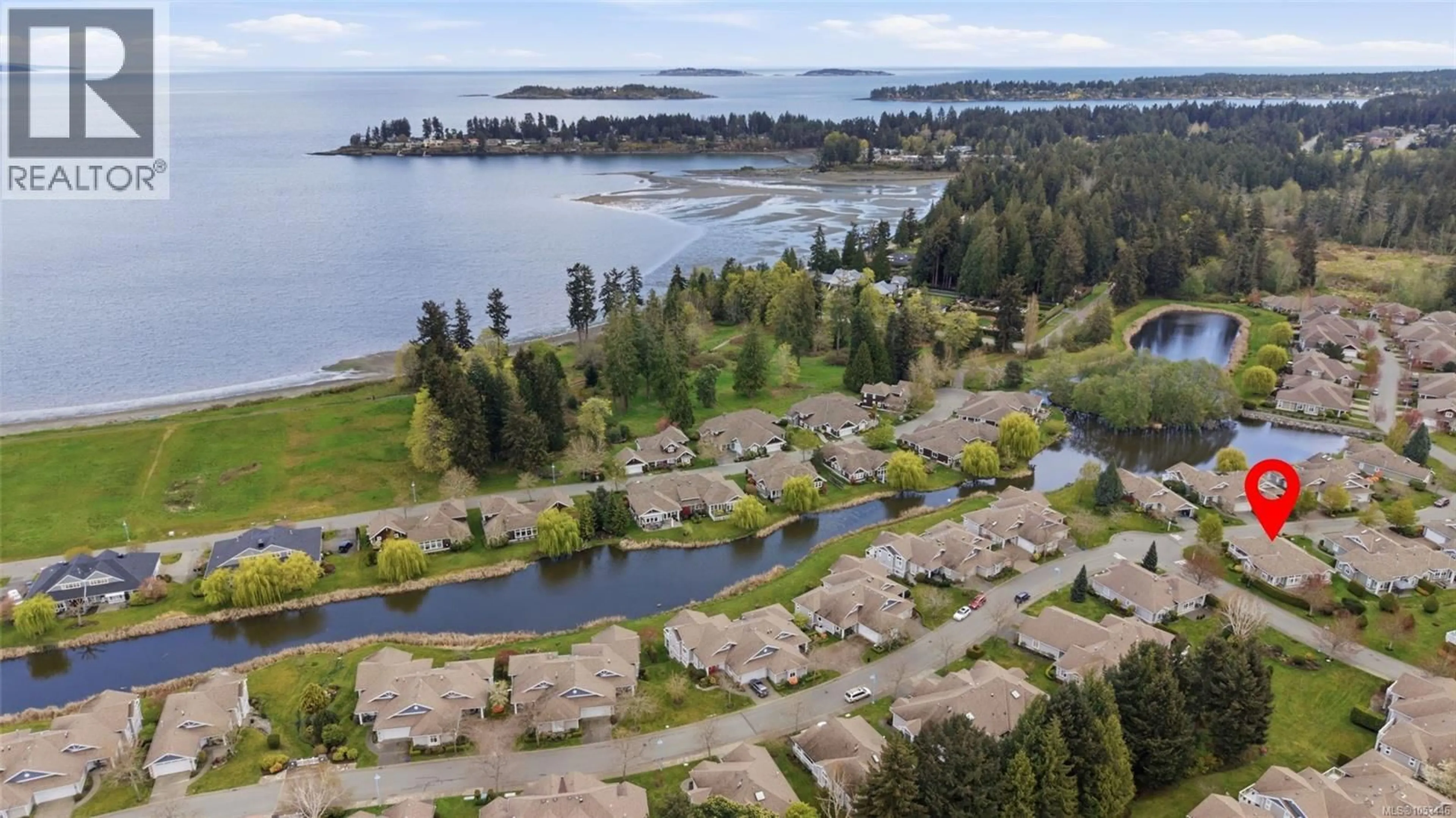 A pic from outside/outdoor area/front of a property/back of a property/a pic from drone, water/lake/river/ocean view for 1372 SATURNA DRIVE, Parksville British Columbia V9P2X9