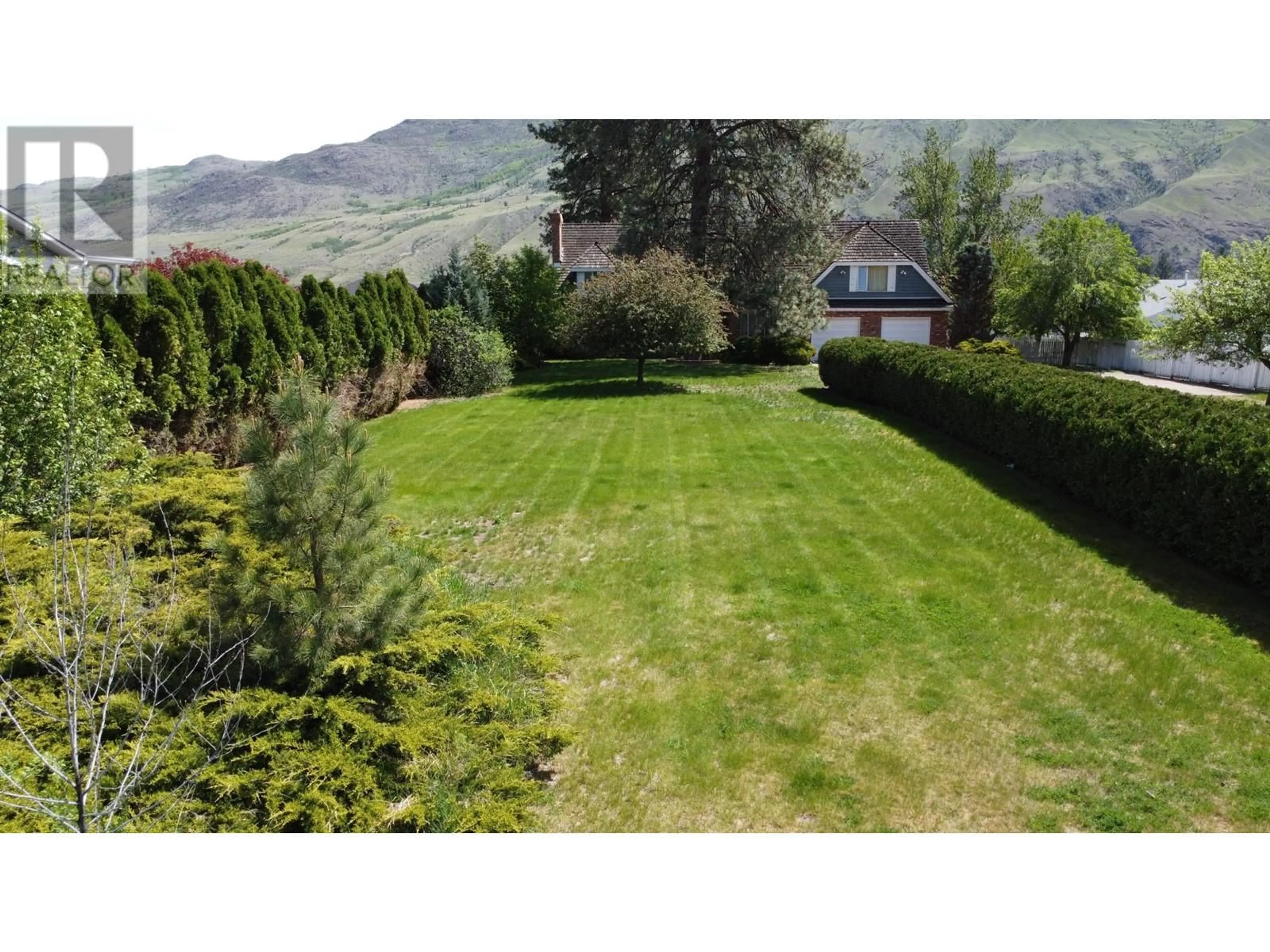 Frontside or backside of a home, the fenced backyard for 2961 BANK Road, Kamloops British Columbia V2B6Y8