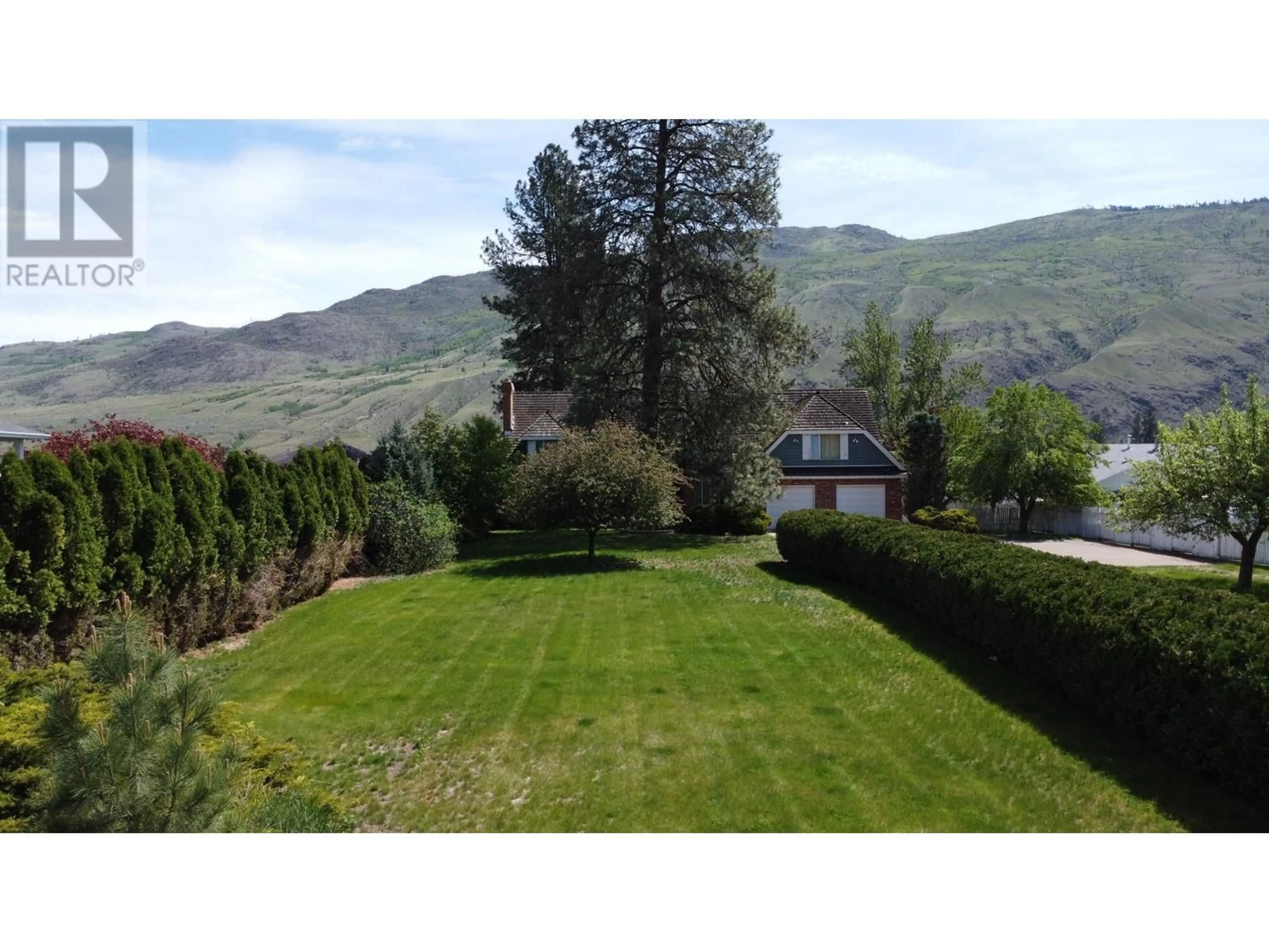 Frontside or backside of a home, the fenced backyard for 2961 BANK Road, Kamloops British Columbia V2B6Y8