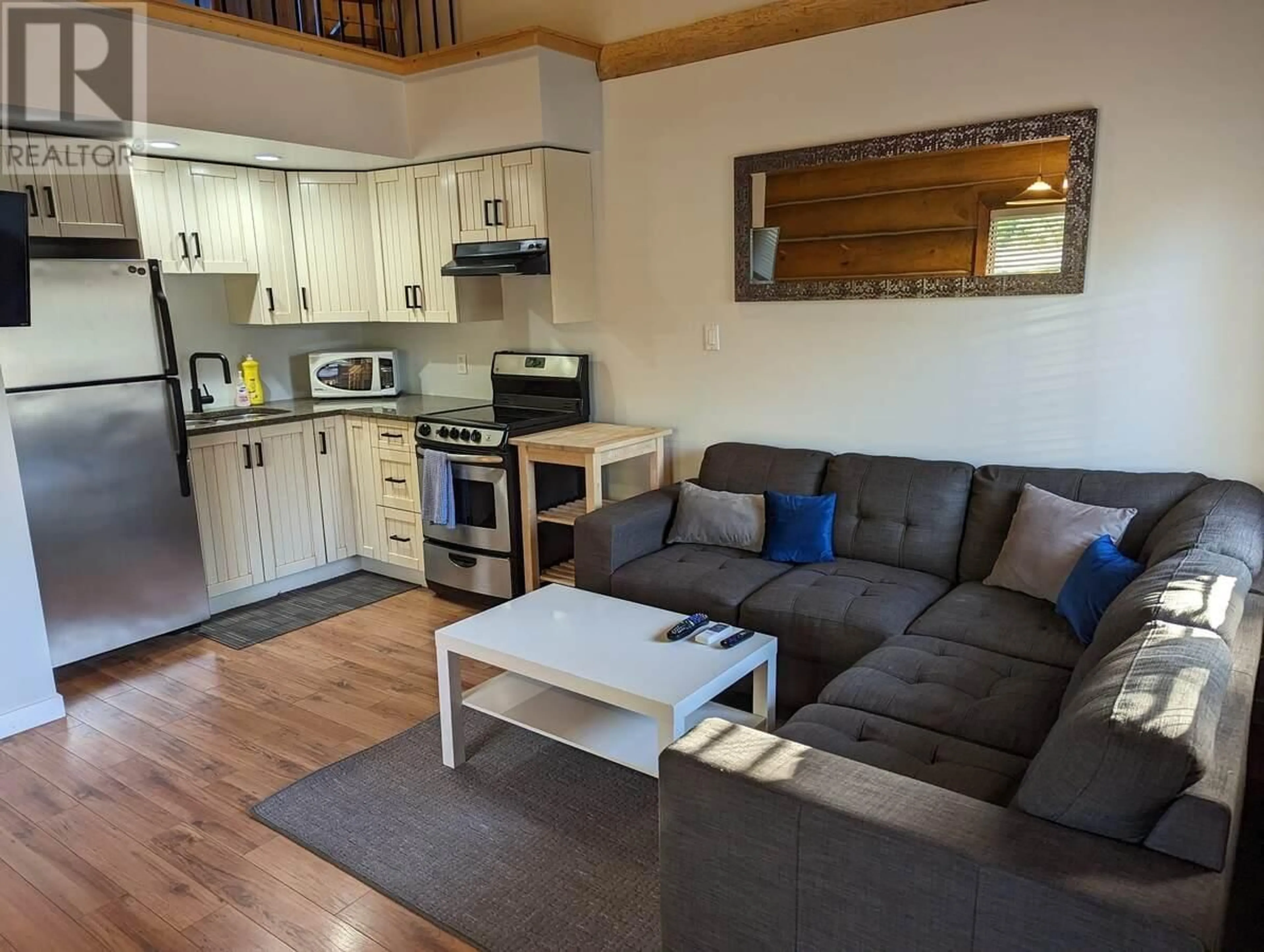 Living room with furniture, wood/laminate floor for 22 - 5485 LAC LE JEUNE ROAD, Kamloops British Columbia V1S1Y8