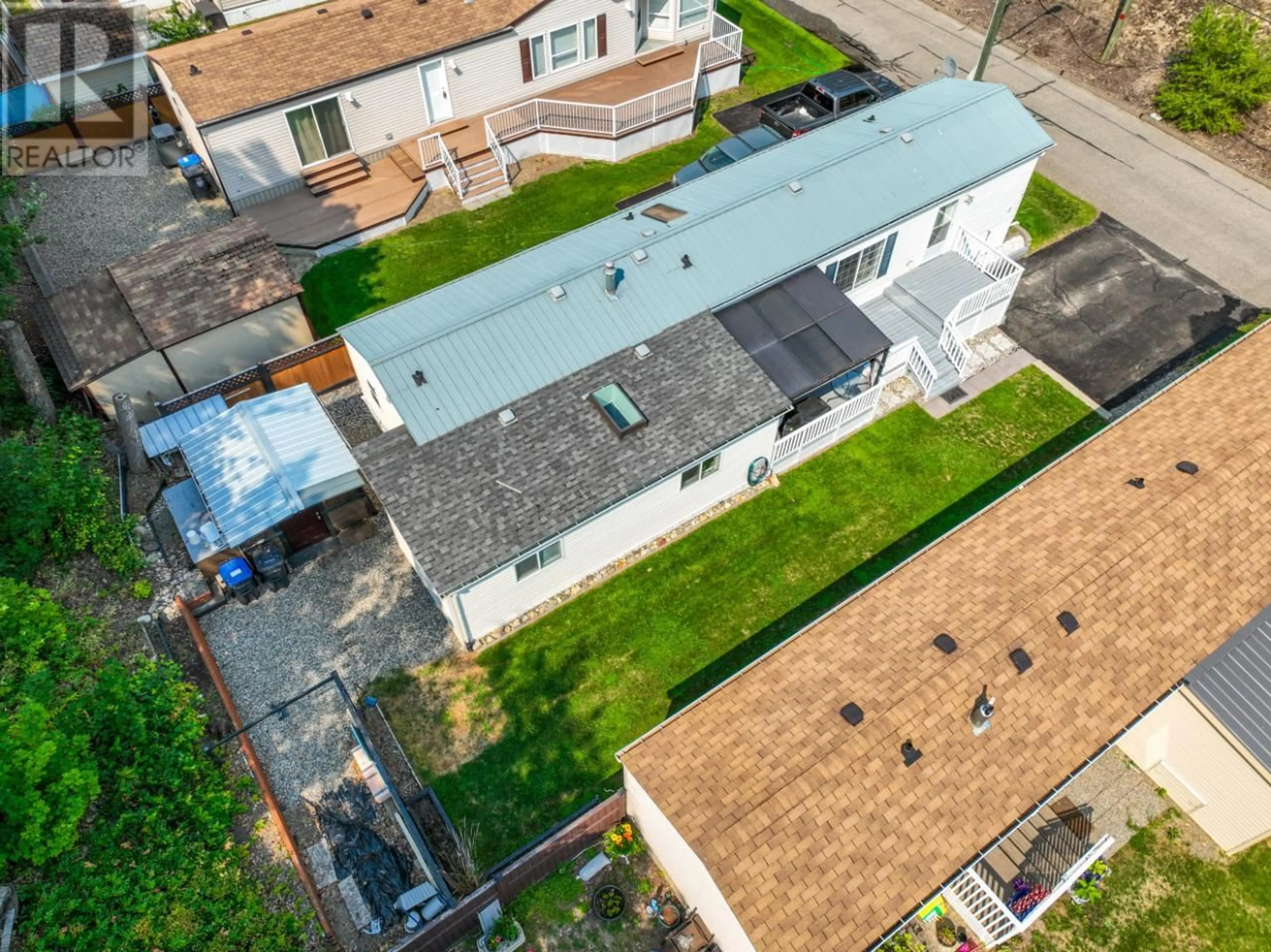 Frontside or backside of a home, the fenced backyard for 1250 HILLSIDE Avenue Unit# 4, Chase British Columbia V0E1M0