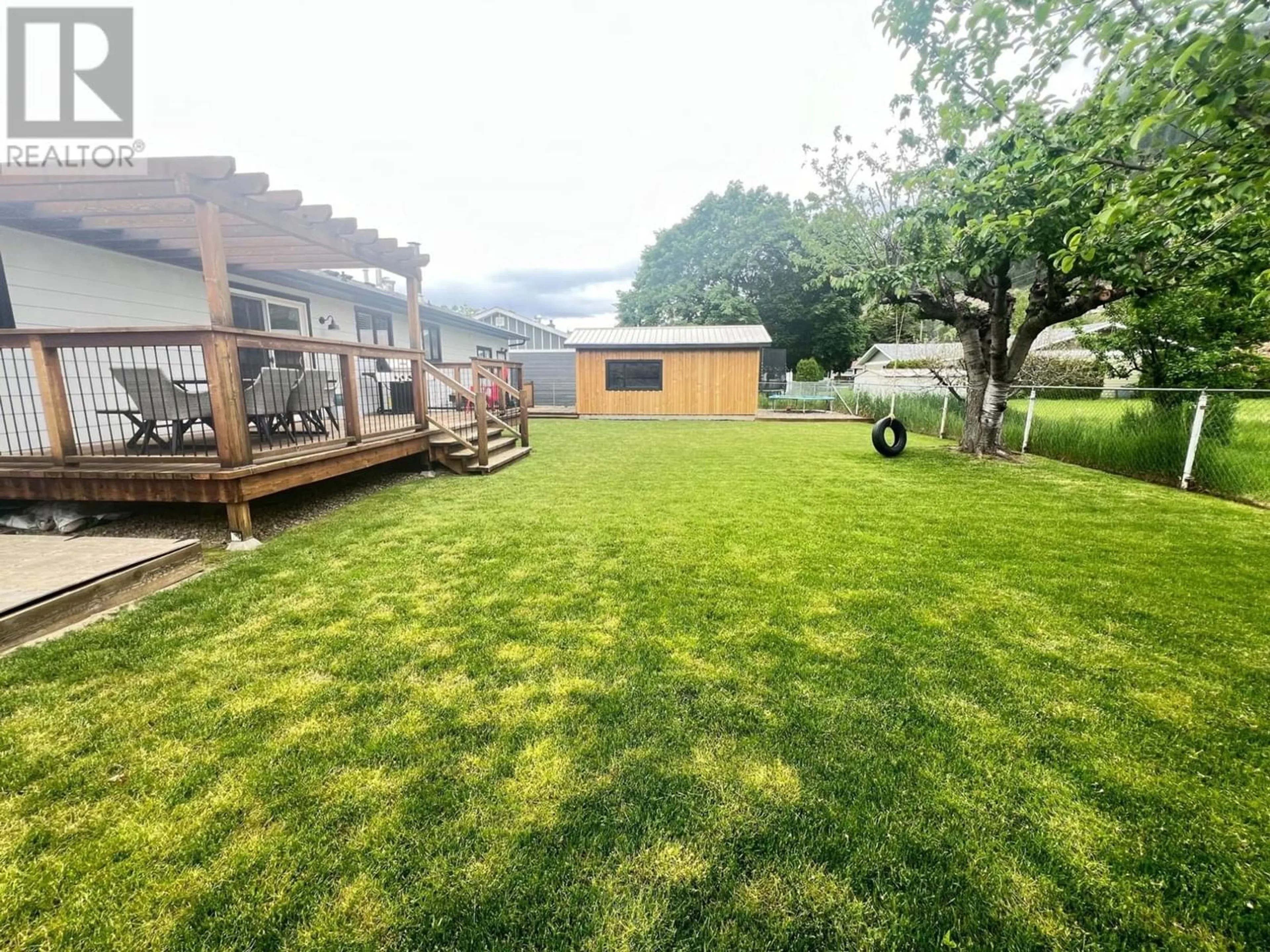 Patio, the fenced backyard for 1107 BEACH Place, Chase British Columbia V0E1M0