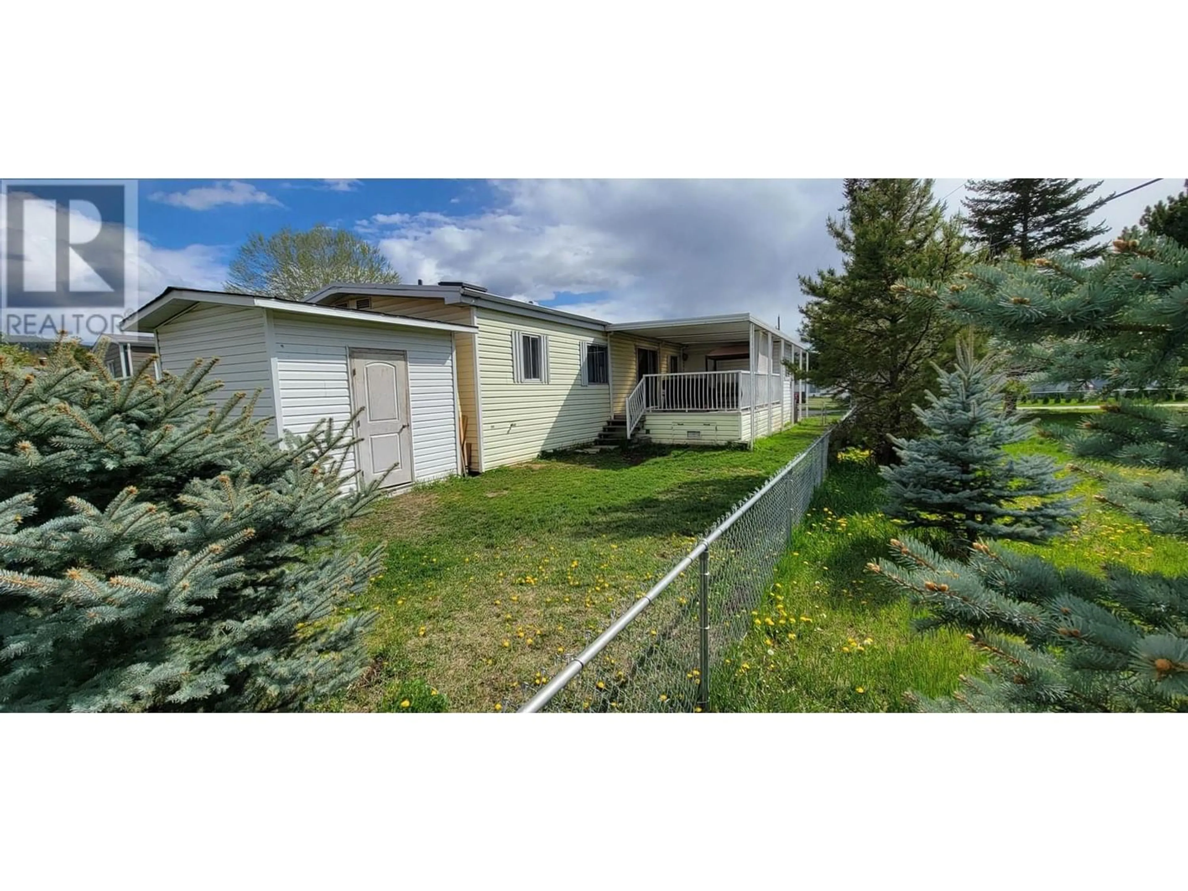 Frontside or backside of a home, the fenced backyard for 2776 CLAPPERTON Avenue Unit# 71, Merritt British Columbia V1K1B8