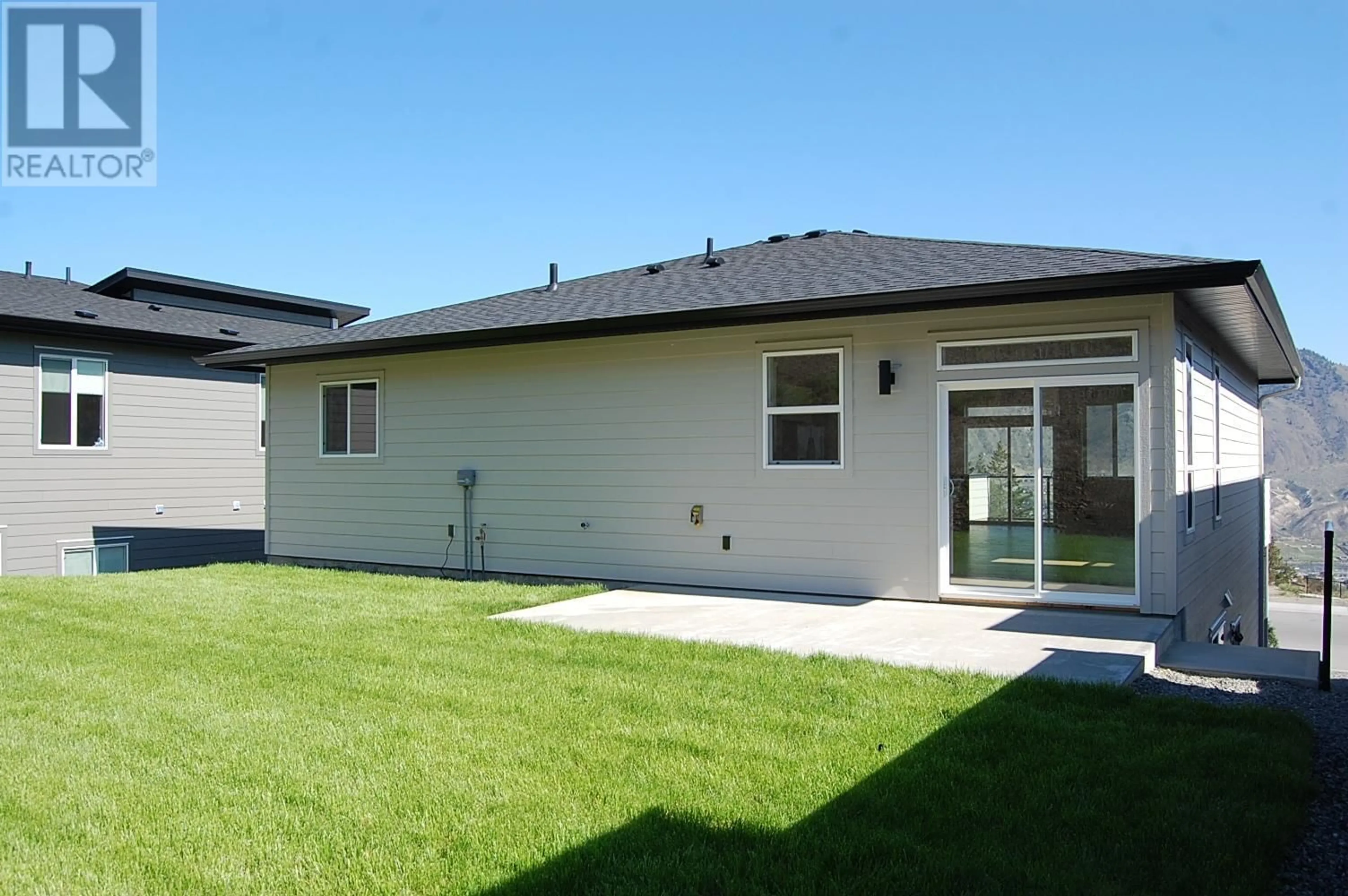 Frontside or backside of a home, the fenced backyard for 2173 GALORE Crescent, Kamloops British Columbia V2C0E4