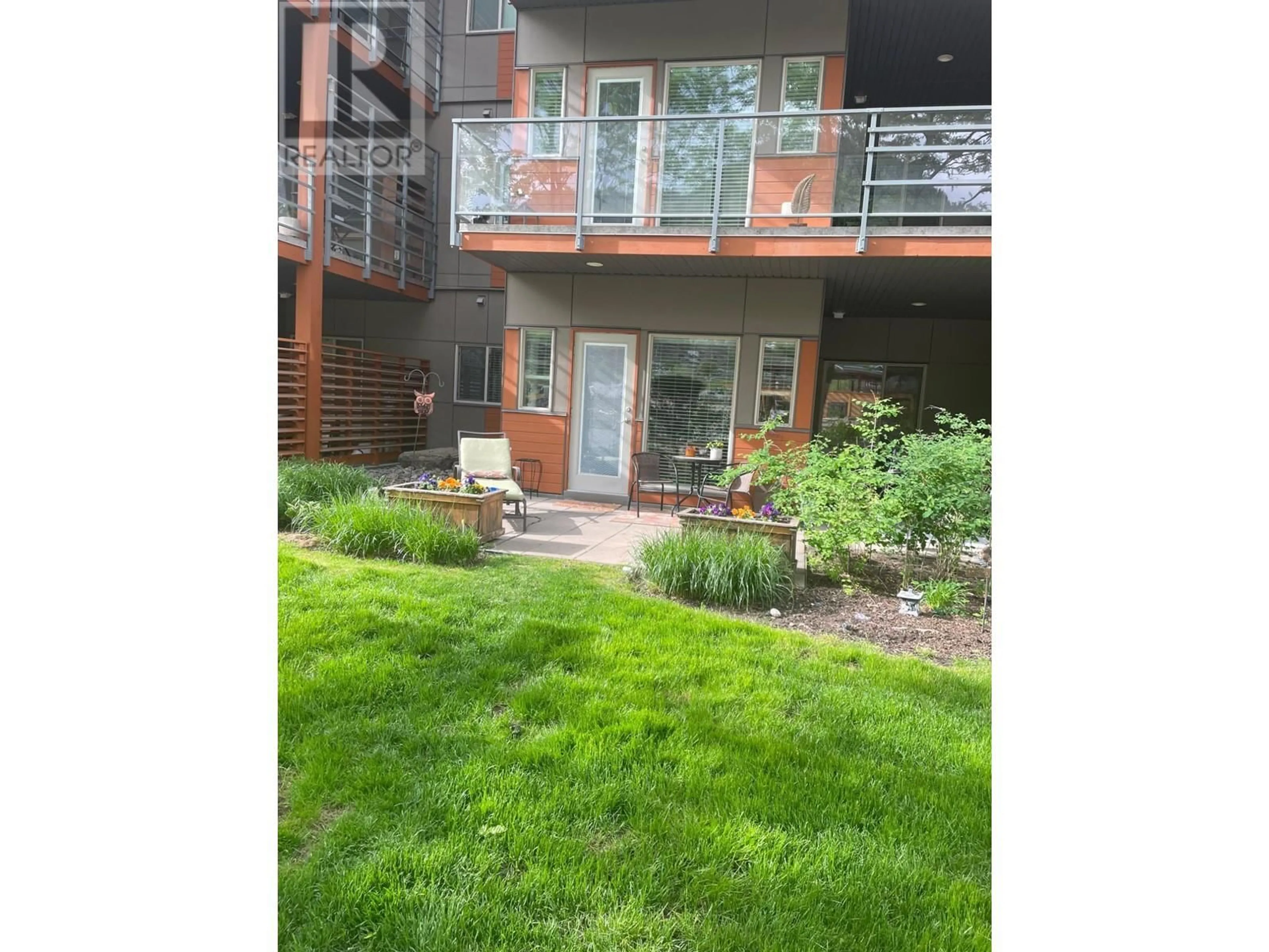 A pic from exterior of the house or condo, the fenced backyard for 1030 TALASA Way Unit# 2106, Kamloops British Columbia V2H0C3