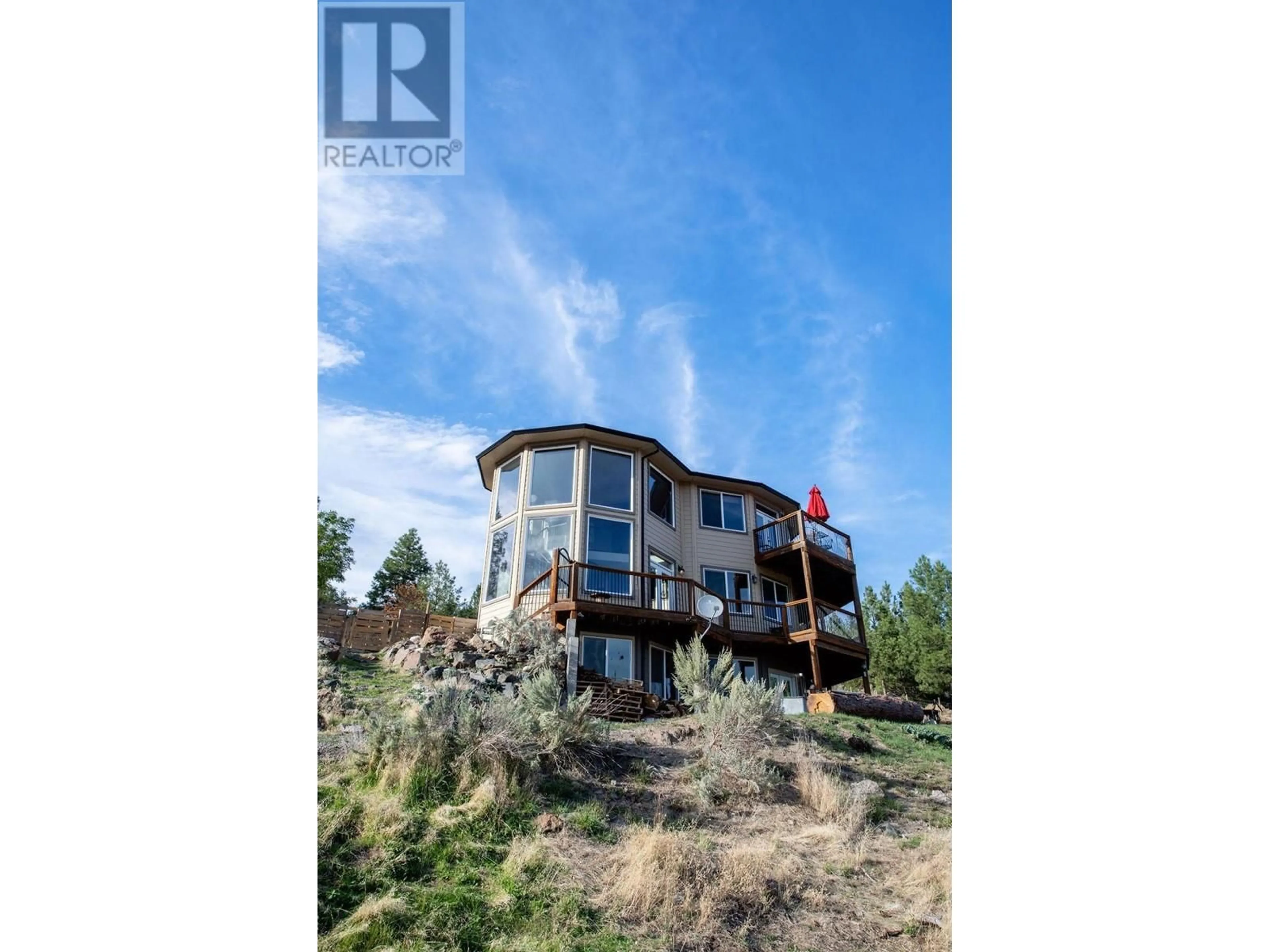 A pic from outside/outdoor area/front of a property/back of a property/a pic from drone, water/lake/river/ocean view for 4377 SHUSWAP ROAD, Kamloops British Columbia V2H1S8