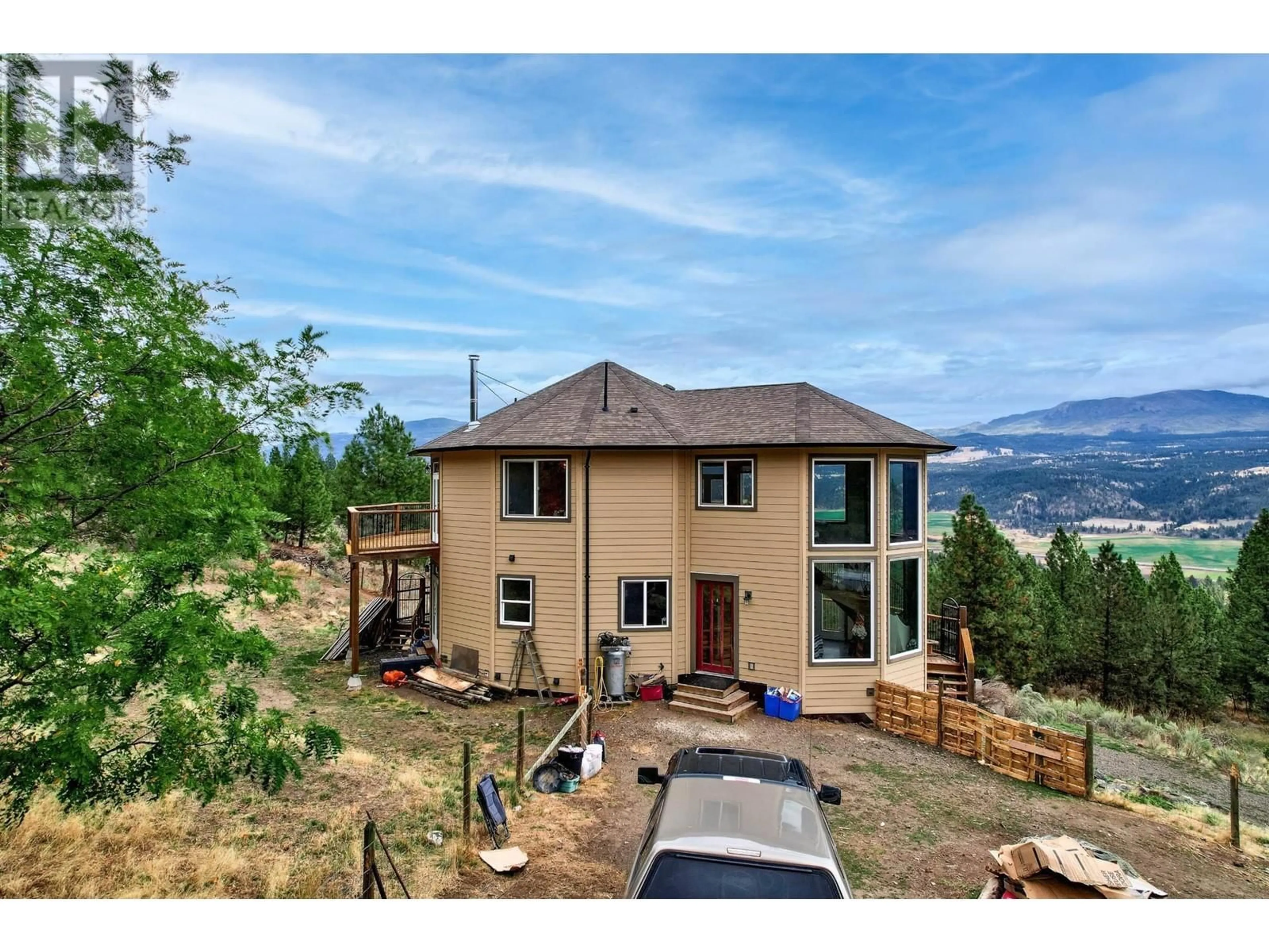 A pic from outside/outdoor area/front of a property/back of a property/a pic from drone, mountain view for 4377 SHUSWAP ROAD, Kamloops British Columbia V2H1S8
