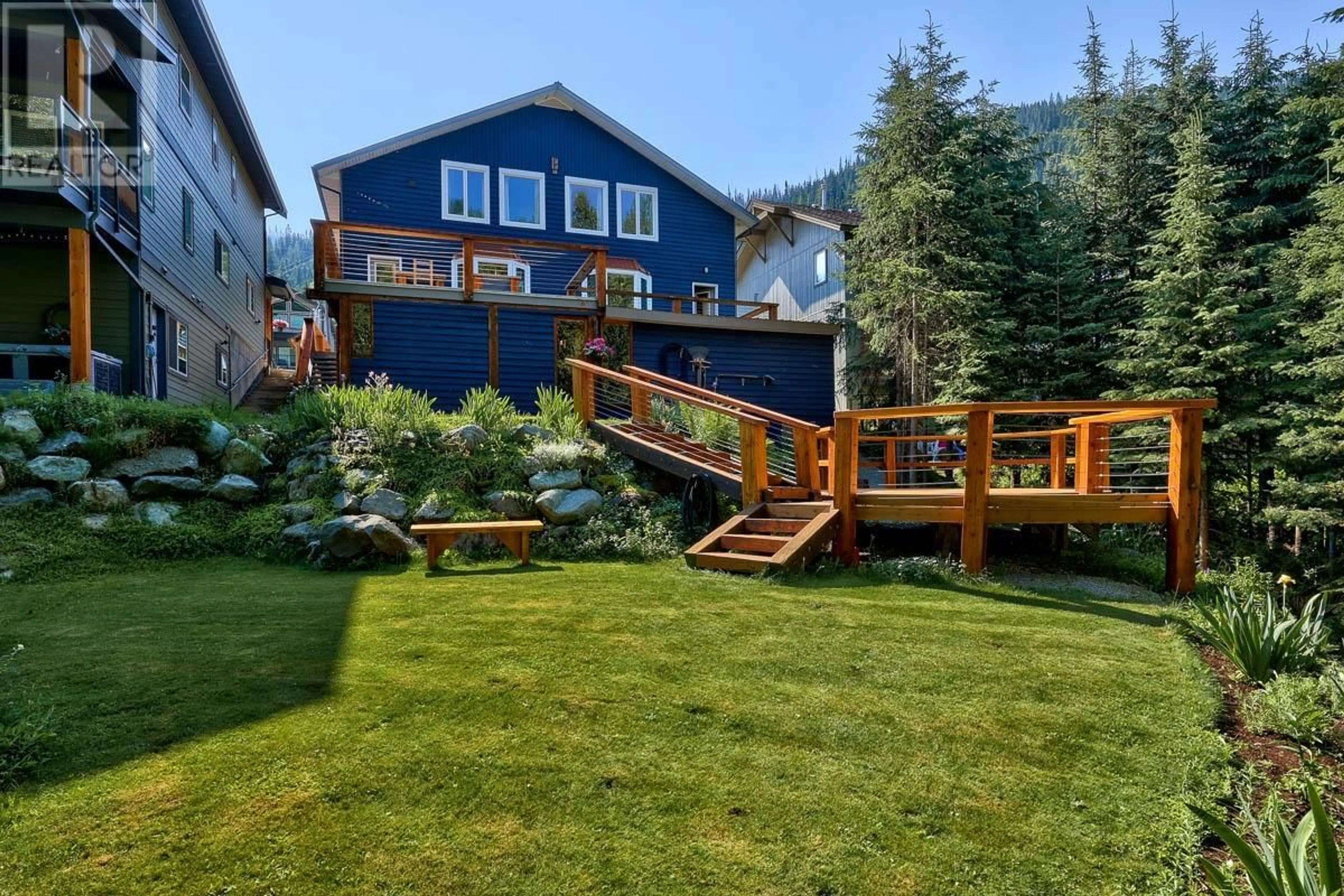 Frontside or backside of a home, the fenced backyard for 1330/1332 BURFIELD Drive, Sun Peaks British Columbia V0E5N0