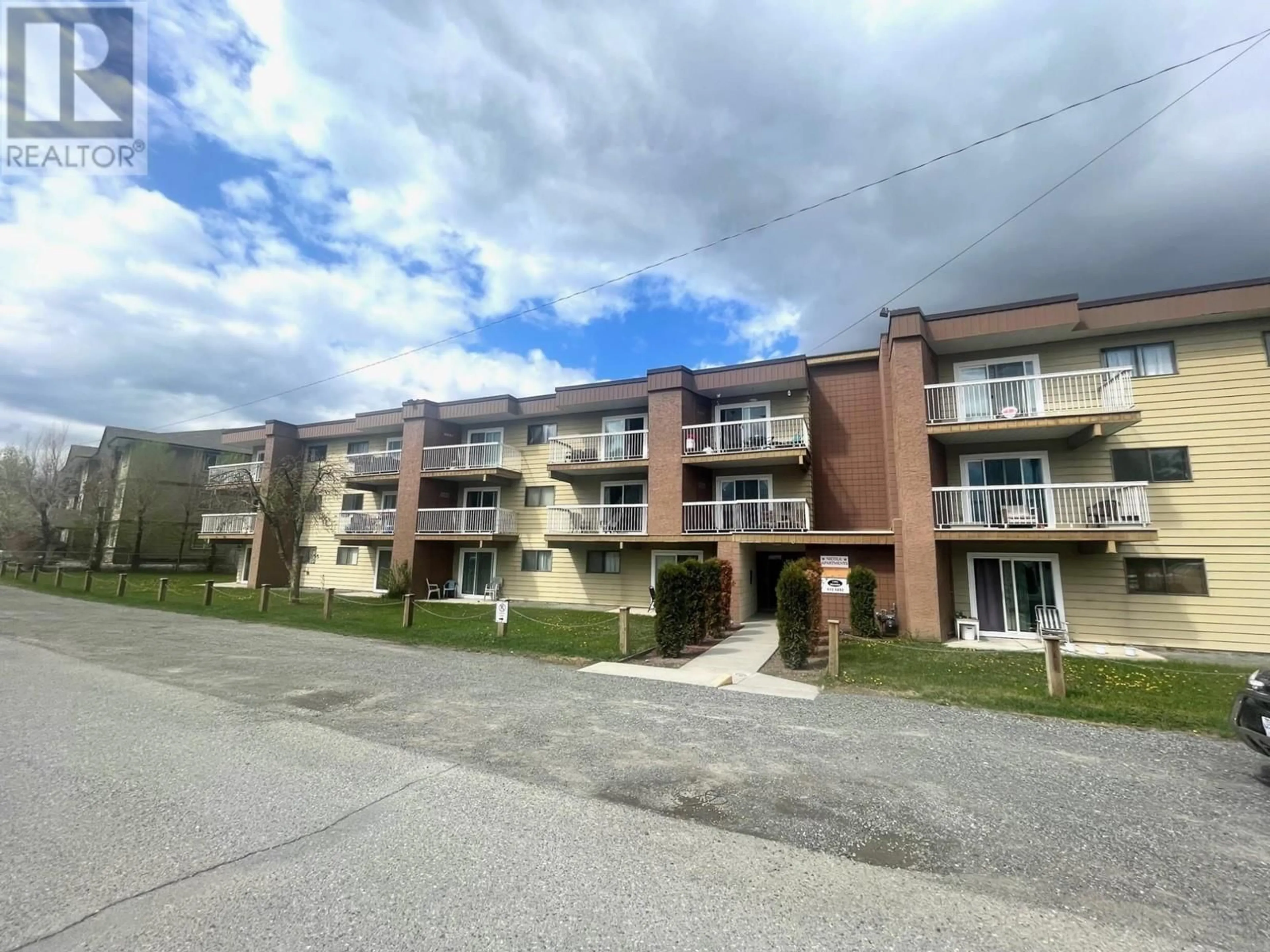 A pic from exterior of the house or condo, the street view for 1703 MENZIES Street Unit# 204, Merritt British Columbia V1K1A6