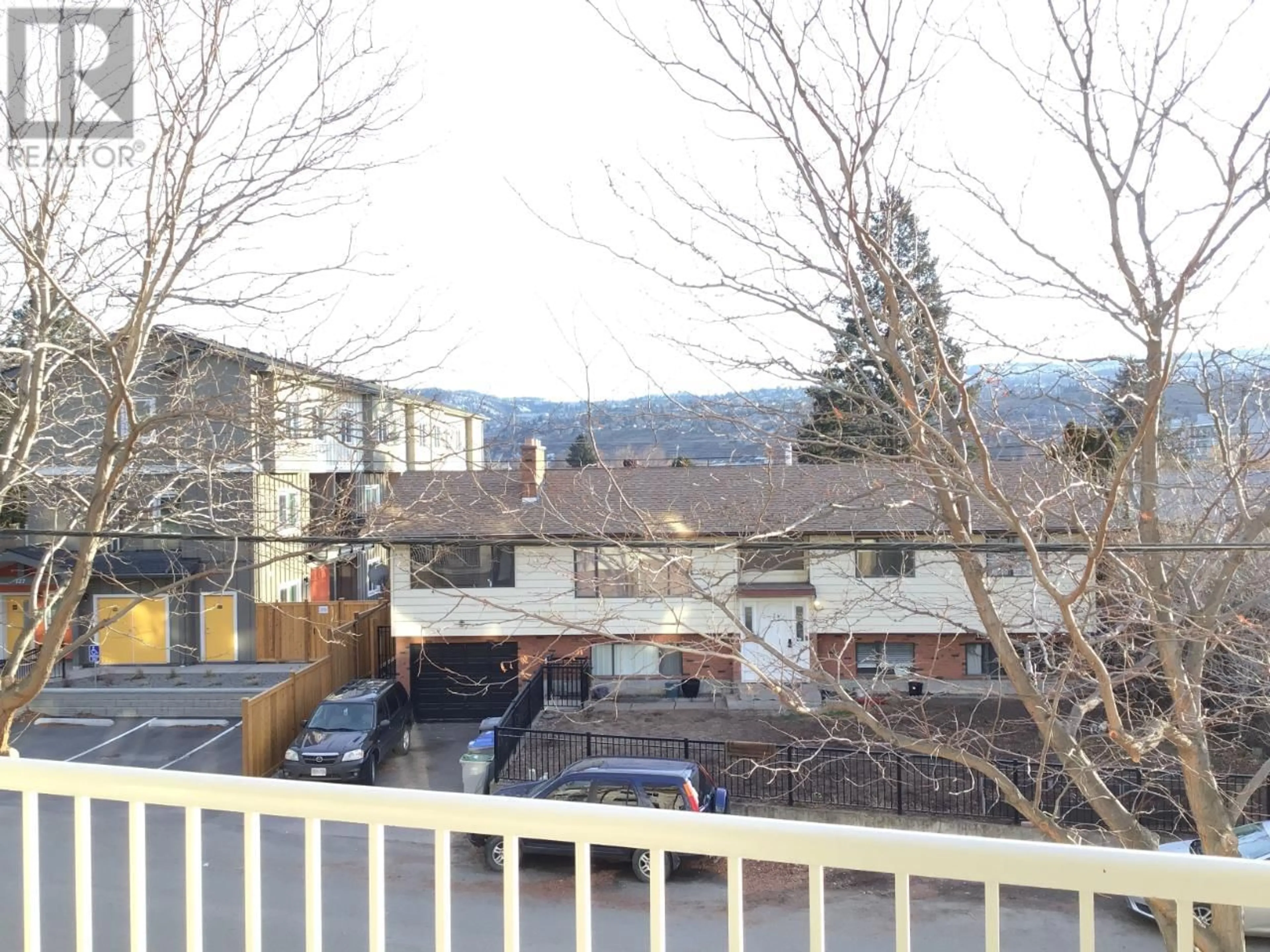 A pic from exterior of the house or condo, the fenced backyard for 120 VERNON Avenue Unit# 309, Kamloops British Columbia V2B1L6