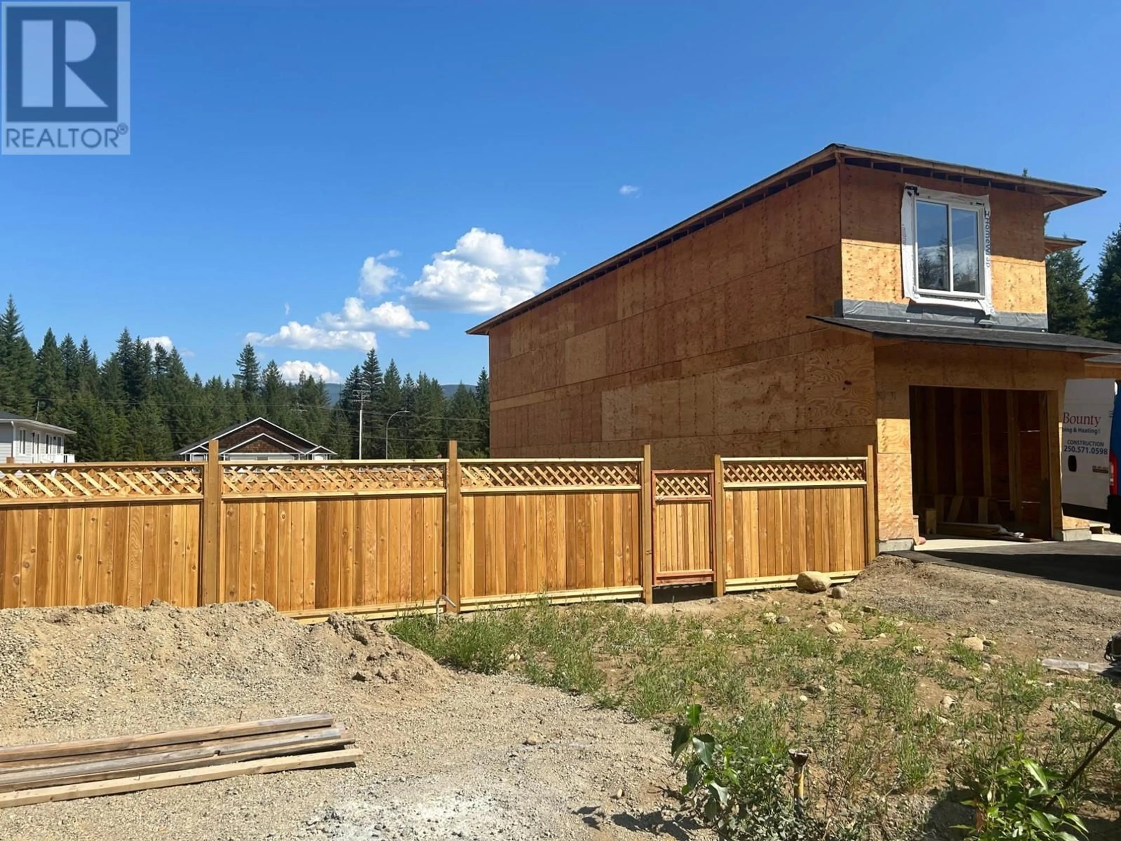 Frontside or backside of a home, the fenced backyard for 400 LYTTON Crescent, Clearwater British Columbia V0E1N1