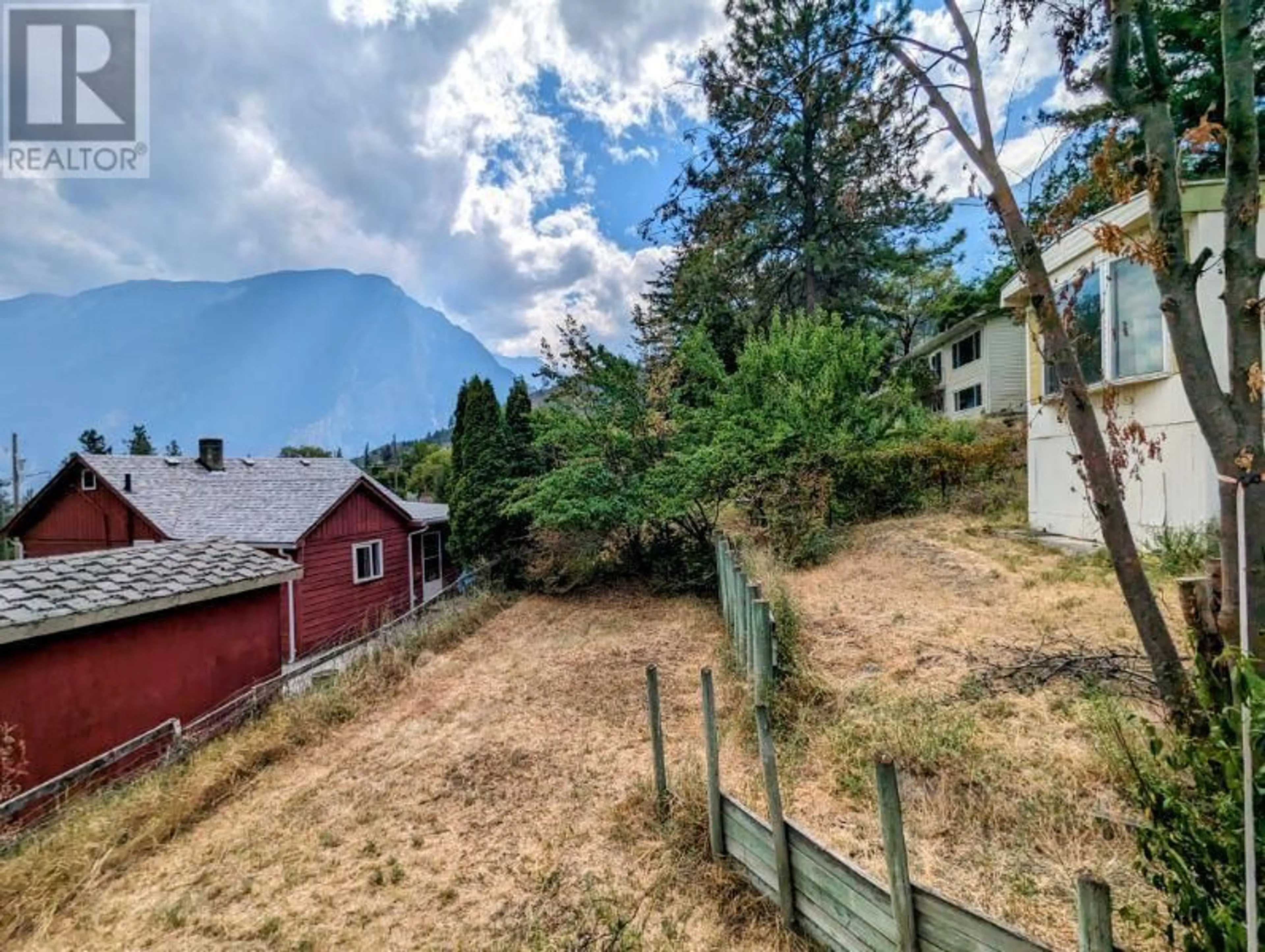 Frontside or backside of a home, the fenced backyard for 618 VICTORIA Street, Lillooet British Columbia V0K2E3