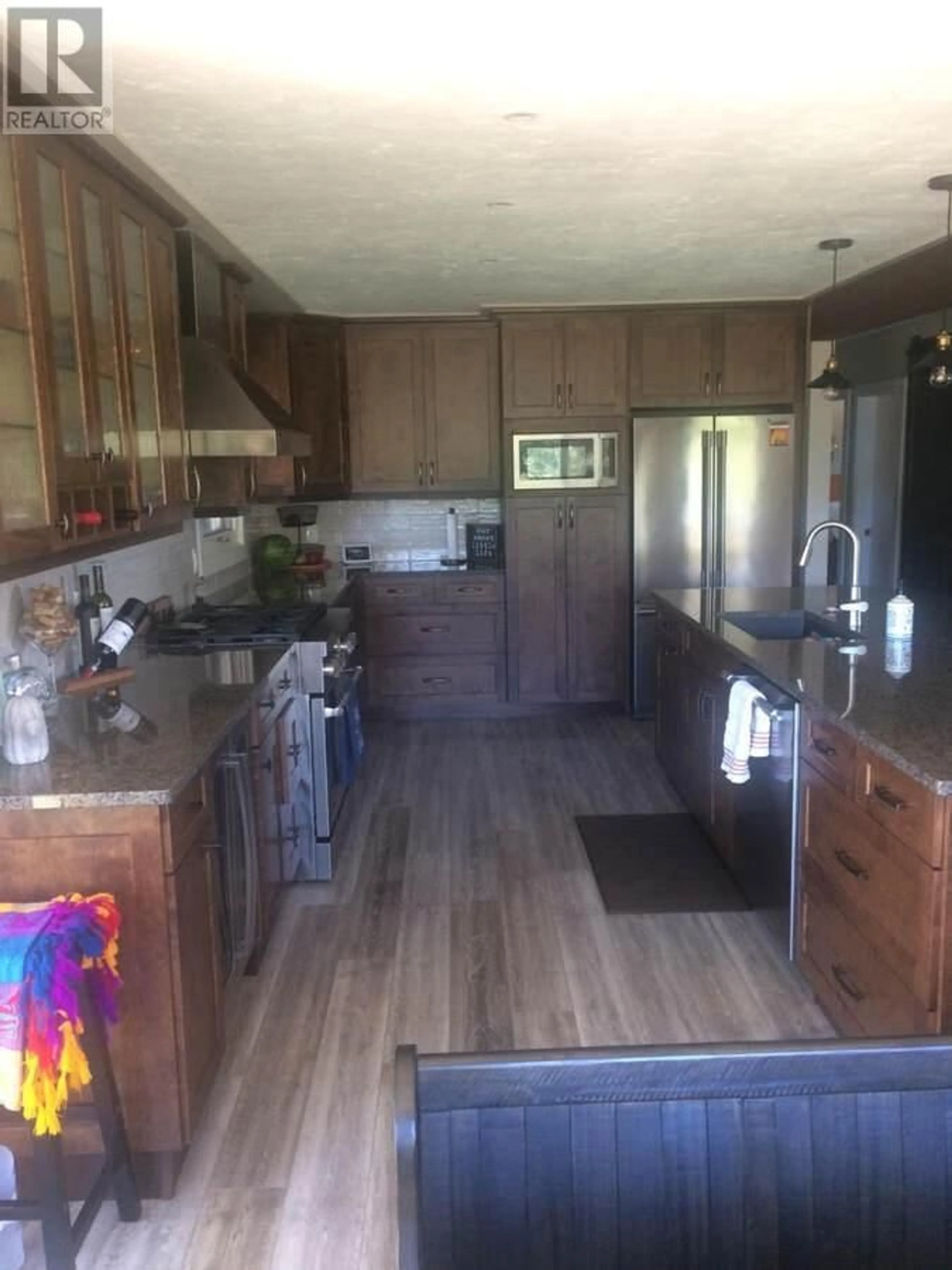 Open concept kitchen, wood/laminate floor for 725 YATES ROAD, Kamloops British Columbia V2B6E1