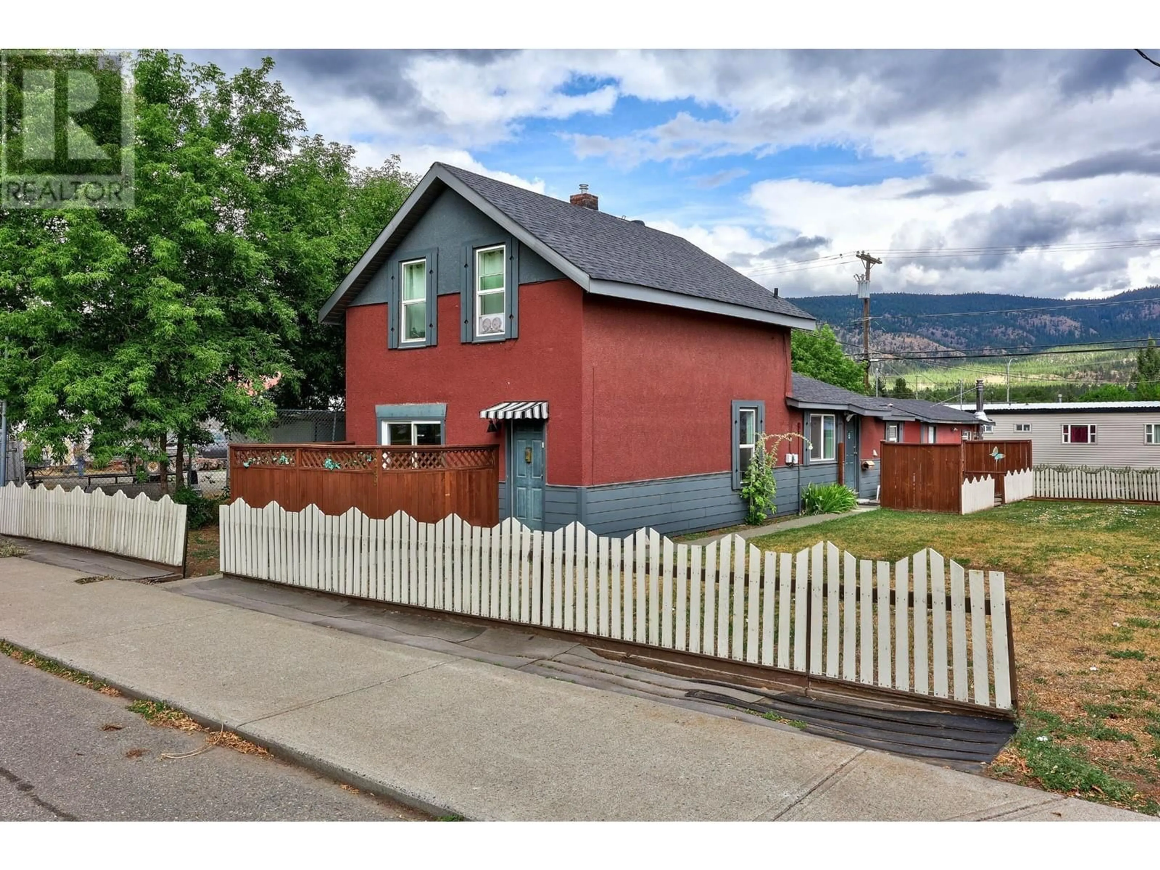 Frontside or backside of a home, the fenced backyard for 2249 GRANITE Avenue, Merritt British Columbia V1K1B8