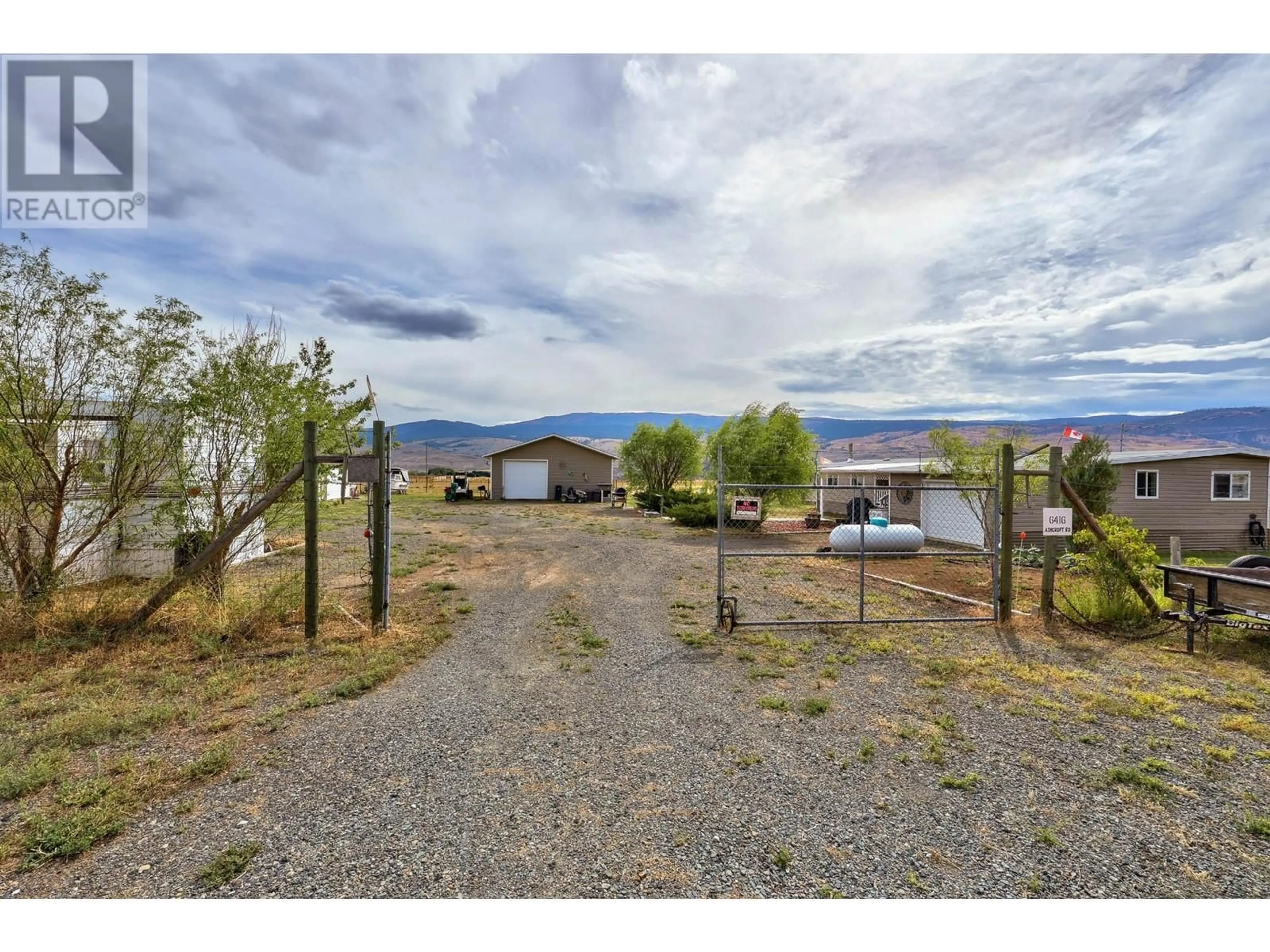 A pic from exterior of the house or condo, the fenced backyard for 6416 ASHCROFT Road, Kamloops British Columbia V2H1T7