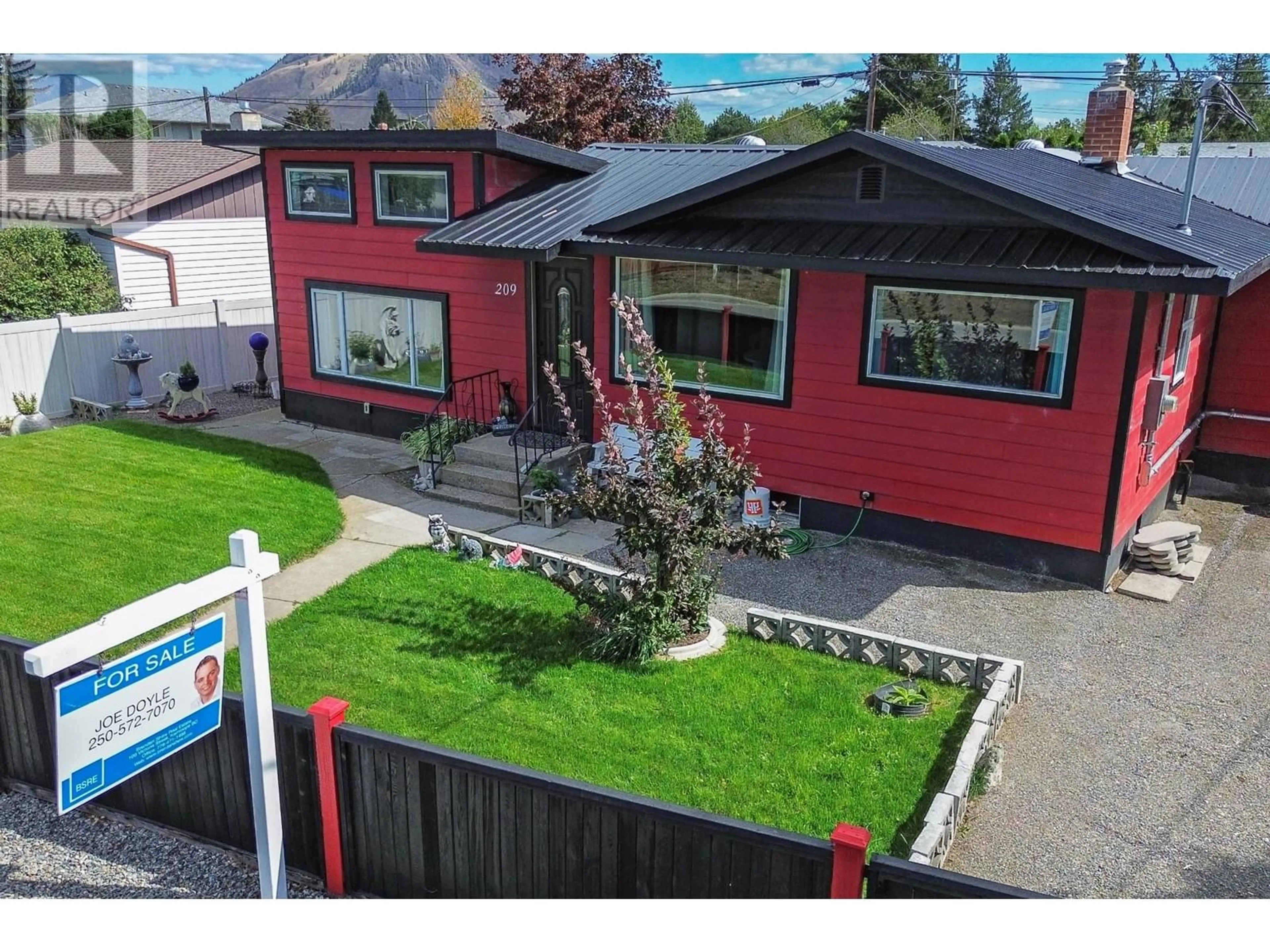 Frontside or backside of a home, the fenced backyard for 209 THRUPP Street, Kamloops British Columbia V2B4B5