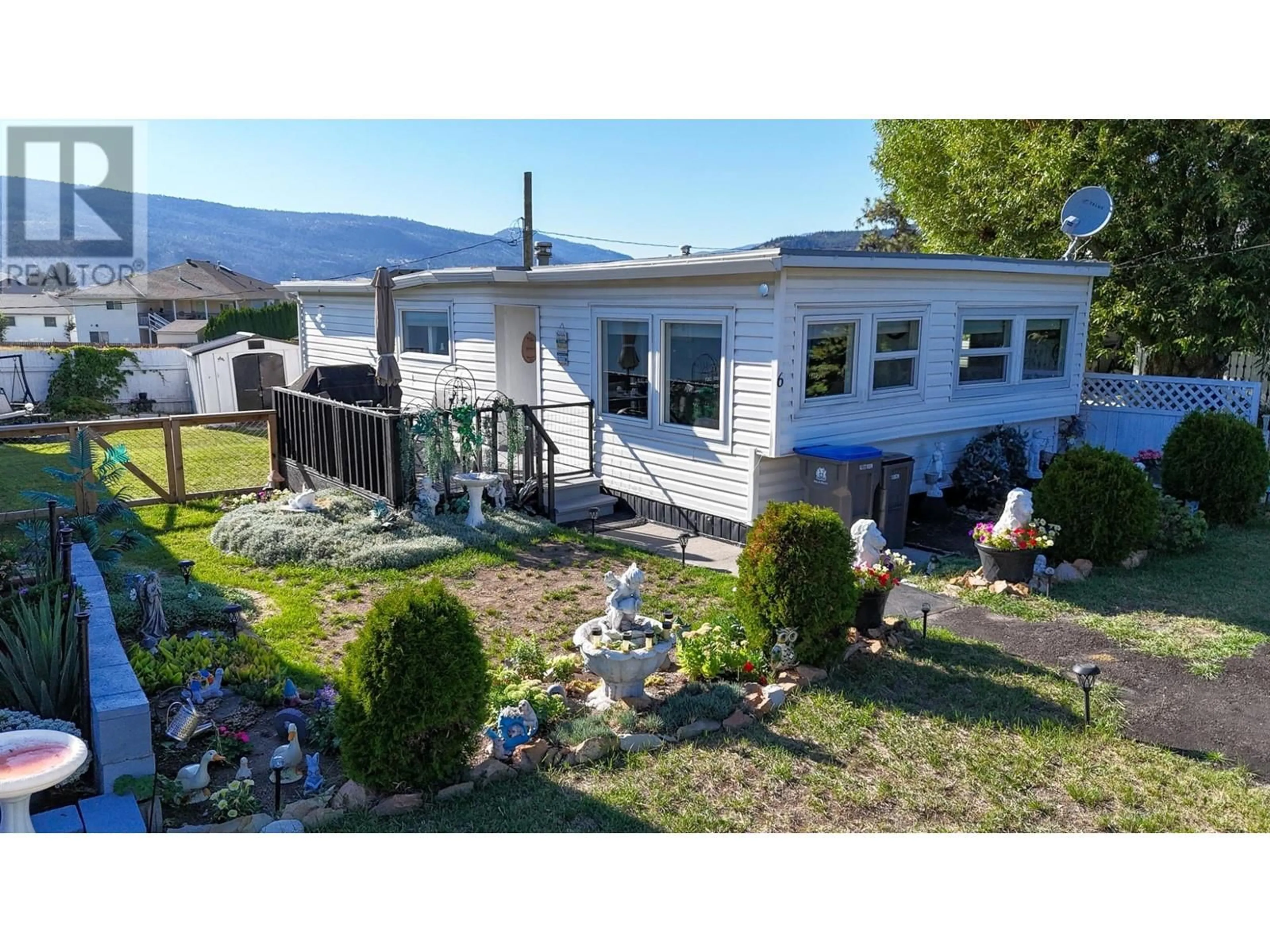 Frontside or backside of a home, the fenced backyard for 3260 SUNSET Street Unit# 6, Merritt British Columbia V1K1B8