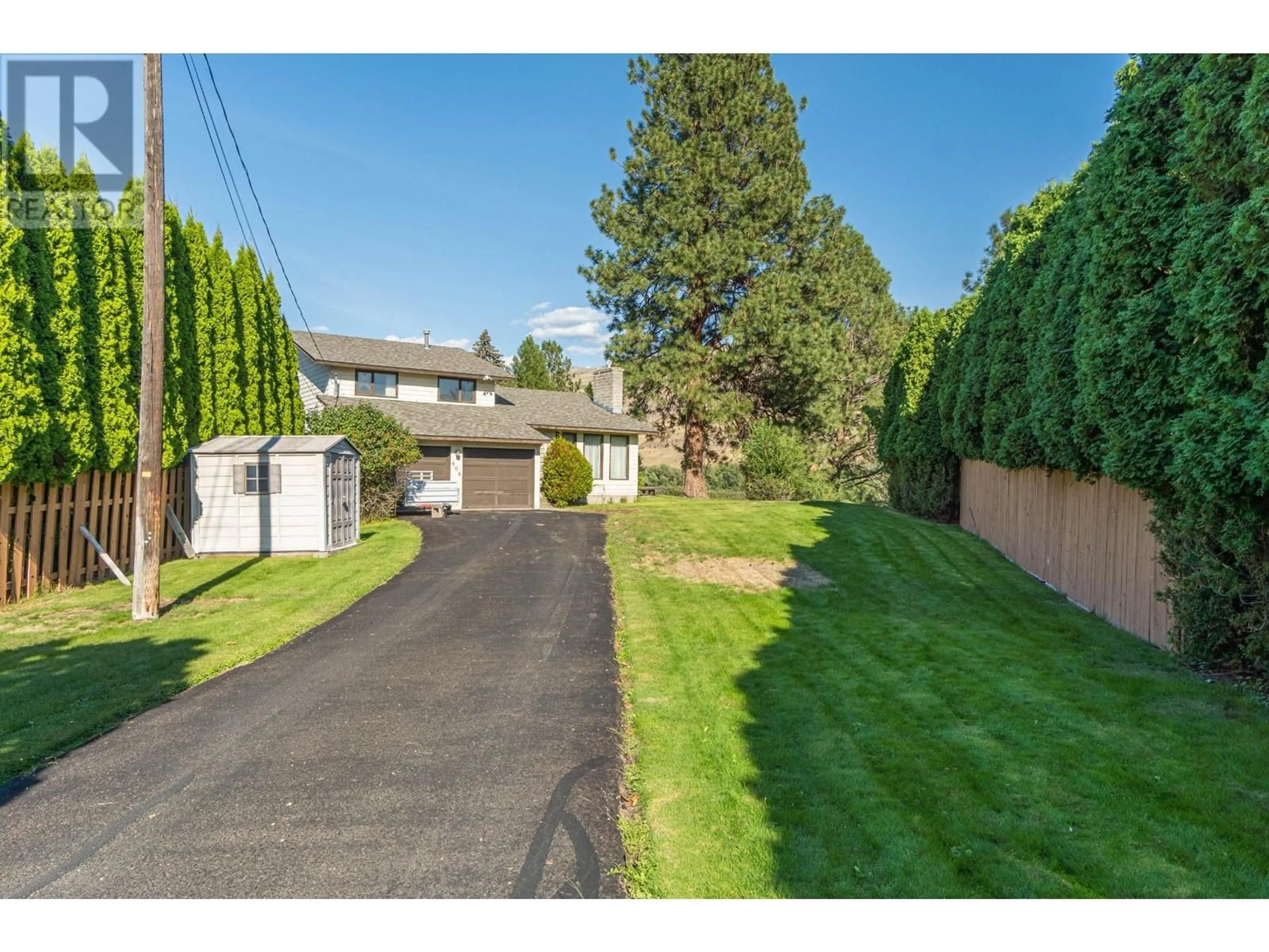 Frontside or backside of a home, the fenced backyard for 606 PORTERFIELD Road, Kamloops British Columbia V2B6M6