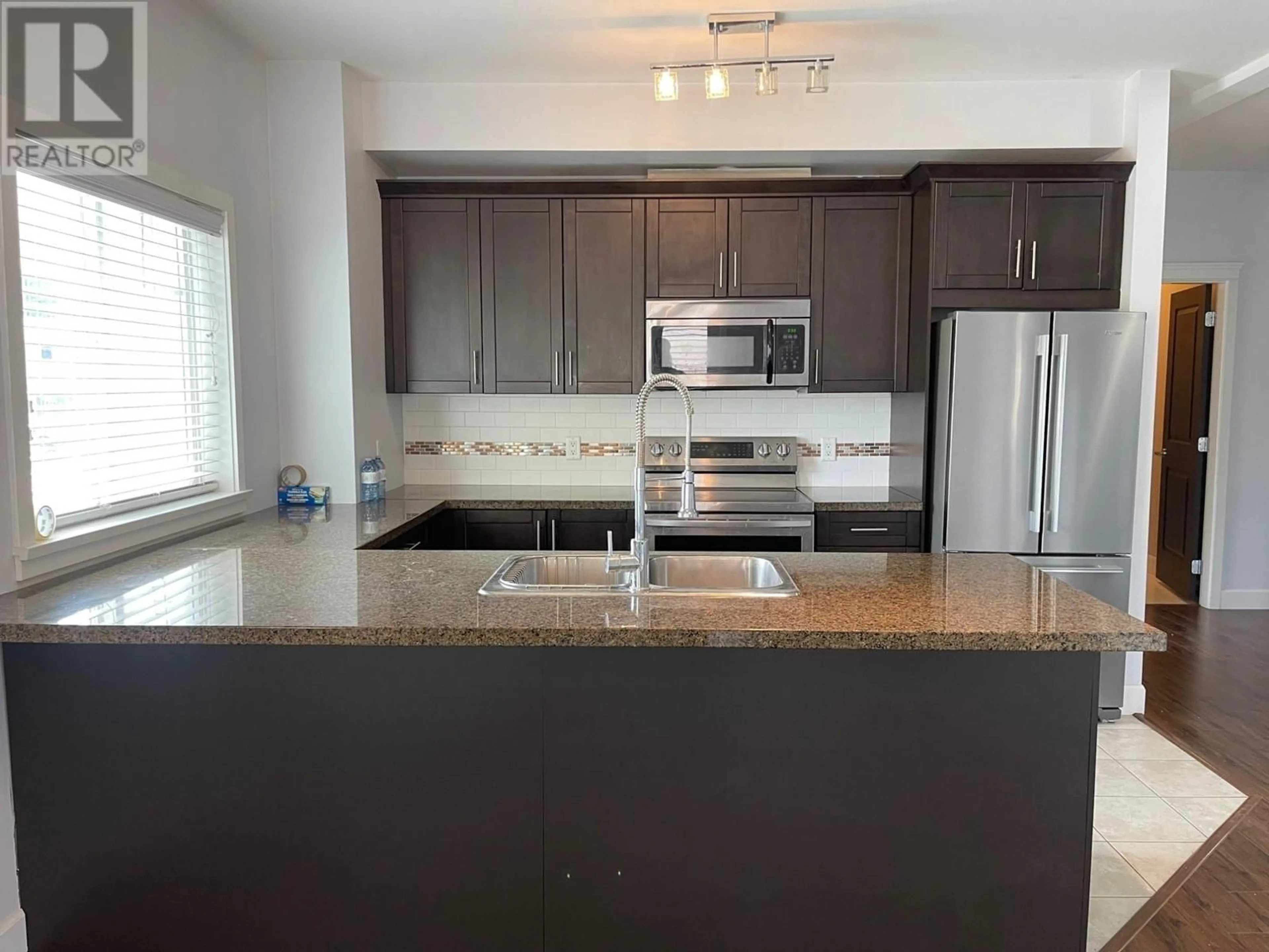 Open concept kitchen for 2799 CLAPPERTON Avenue Unit# 203, Merritt British Columbia V1K1A2