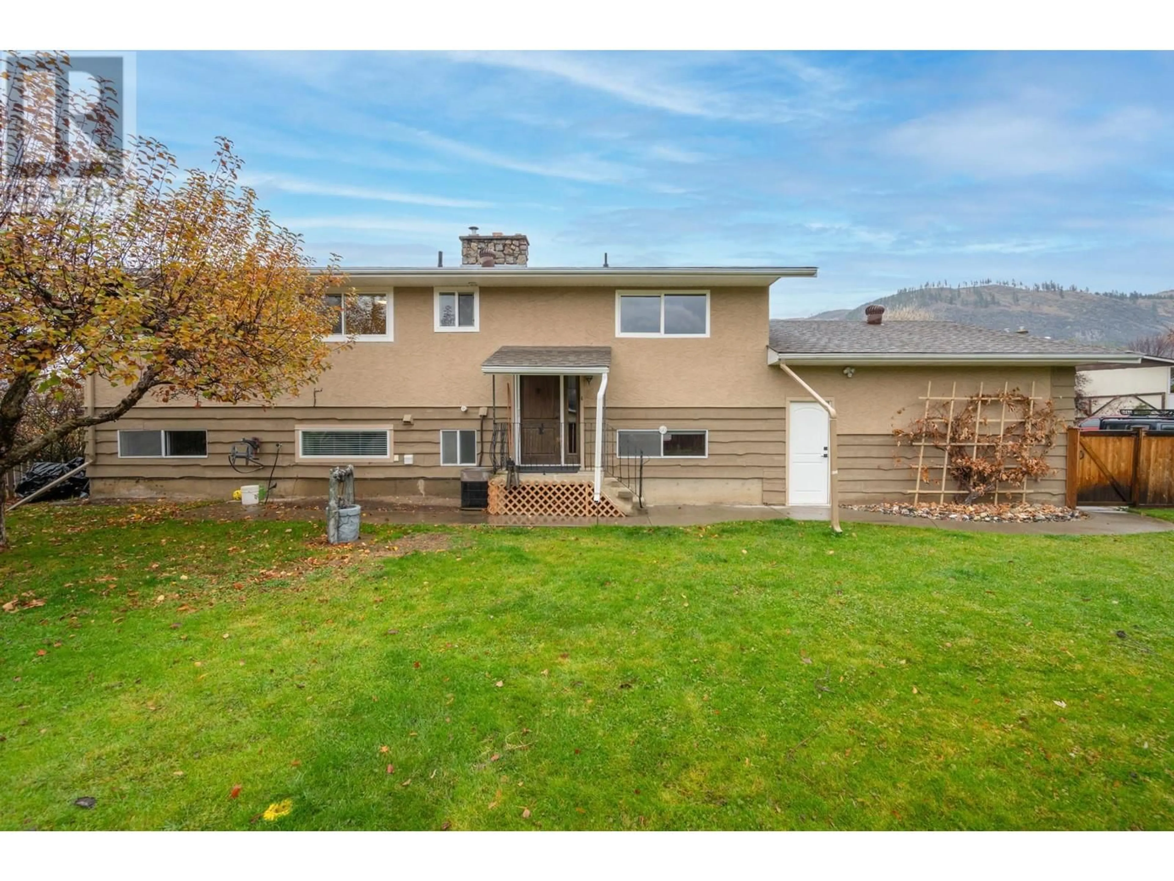 Frontside or backside of a home, the fenced backyard for 4875 KATHLEEN Place, Kamloops British Columbia V2H1M1