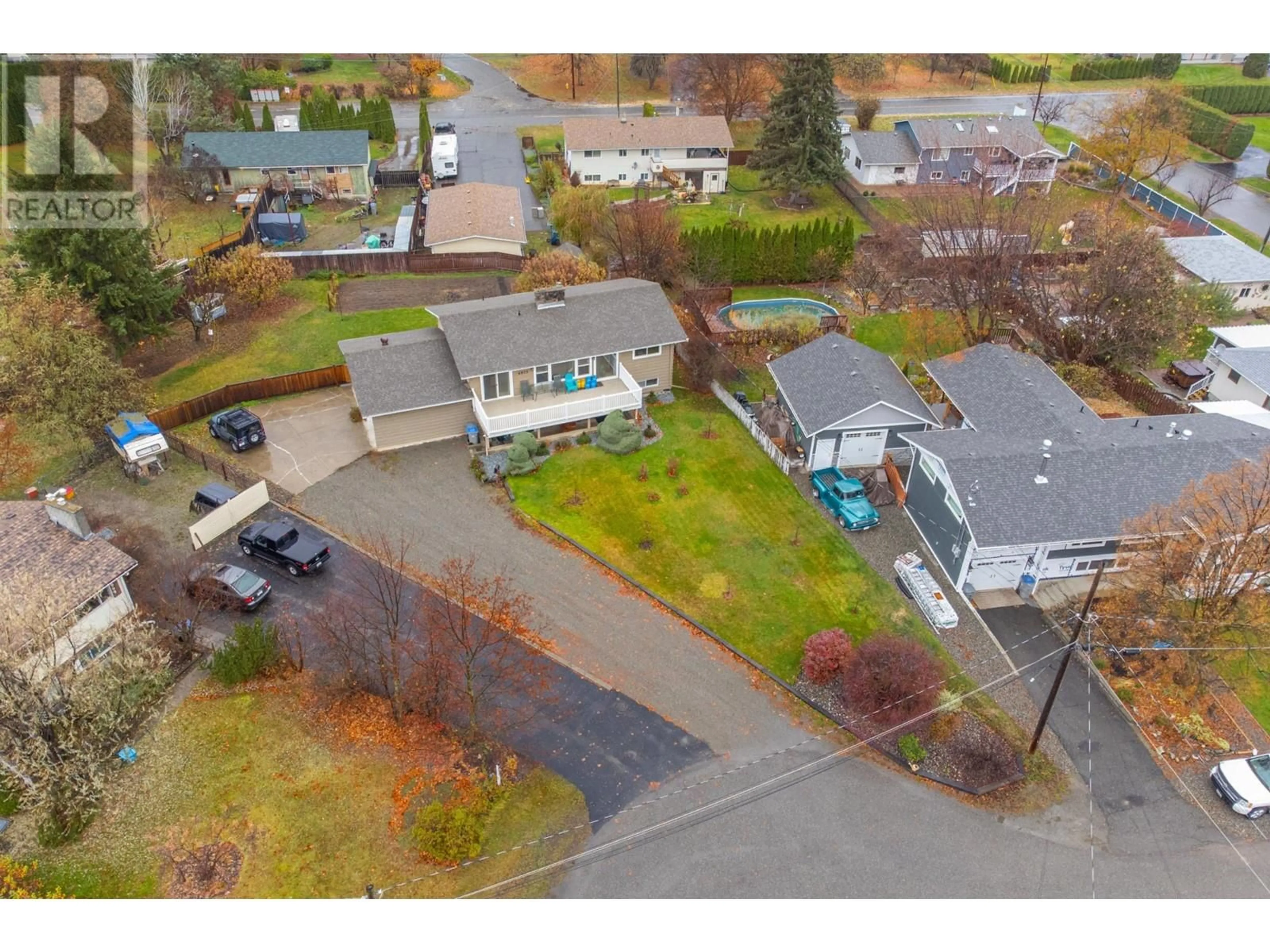 Frontside or backside of a home, the fenced backyard for 4875 KATHLEEN Place, Kamloops British Columbia V2H1M1