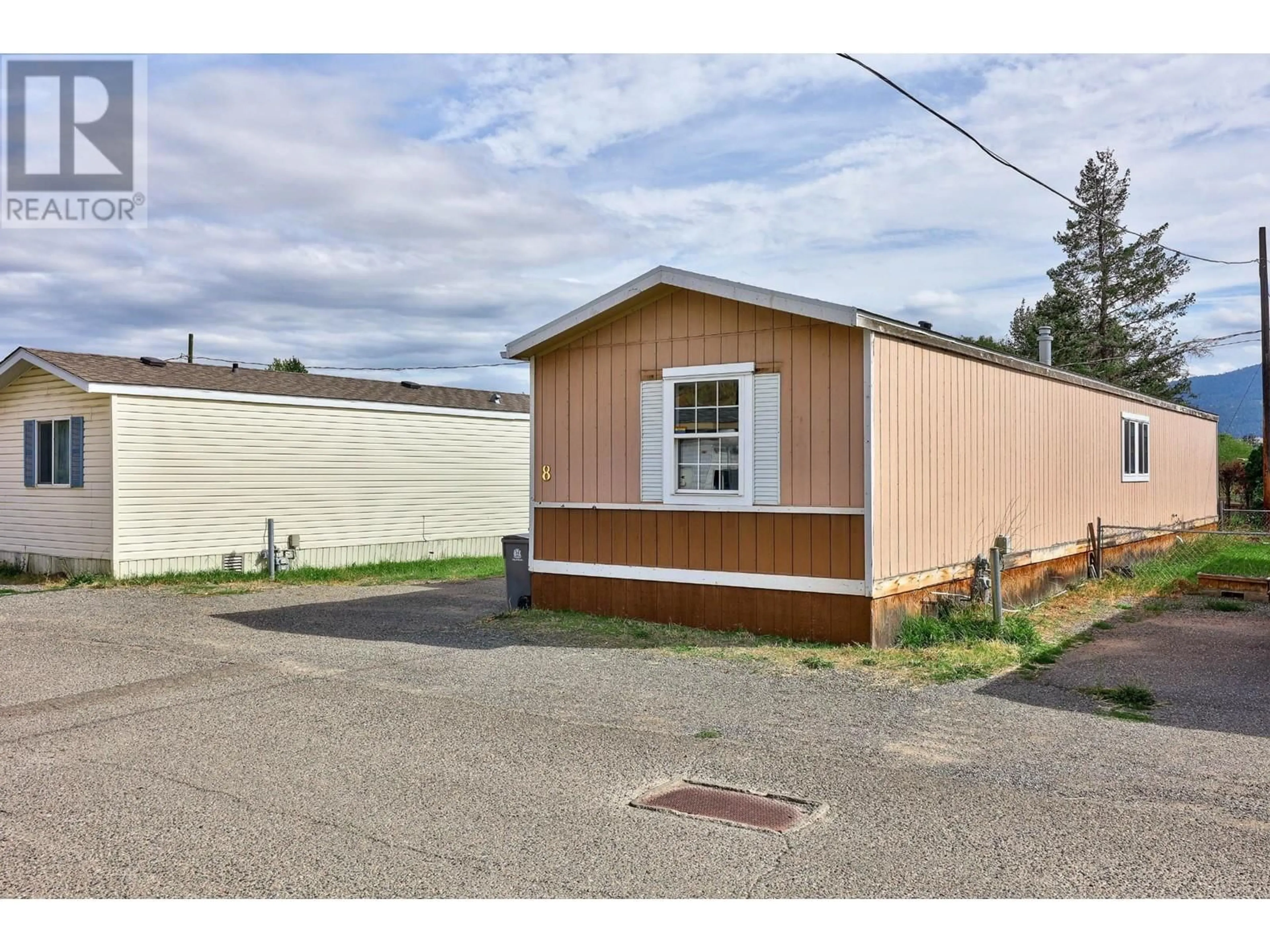 A pic from exterior of the house or condo, the street view for 1401 NICOLA Avenue Unit# 8, Merritt British Columbia V1K1B8