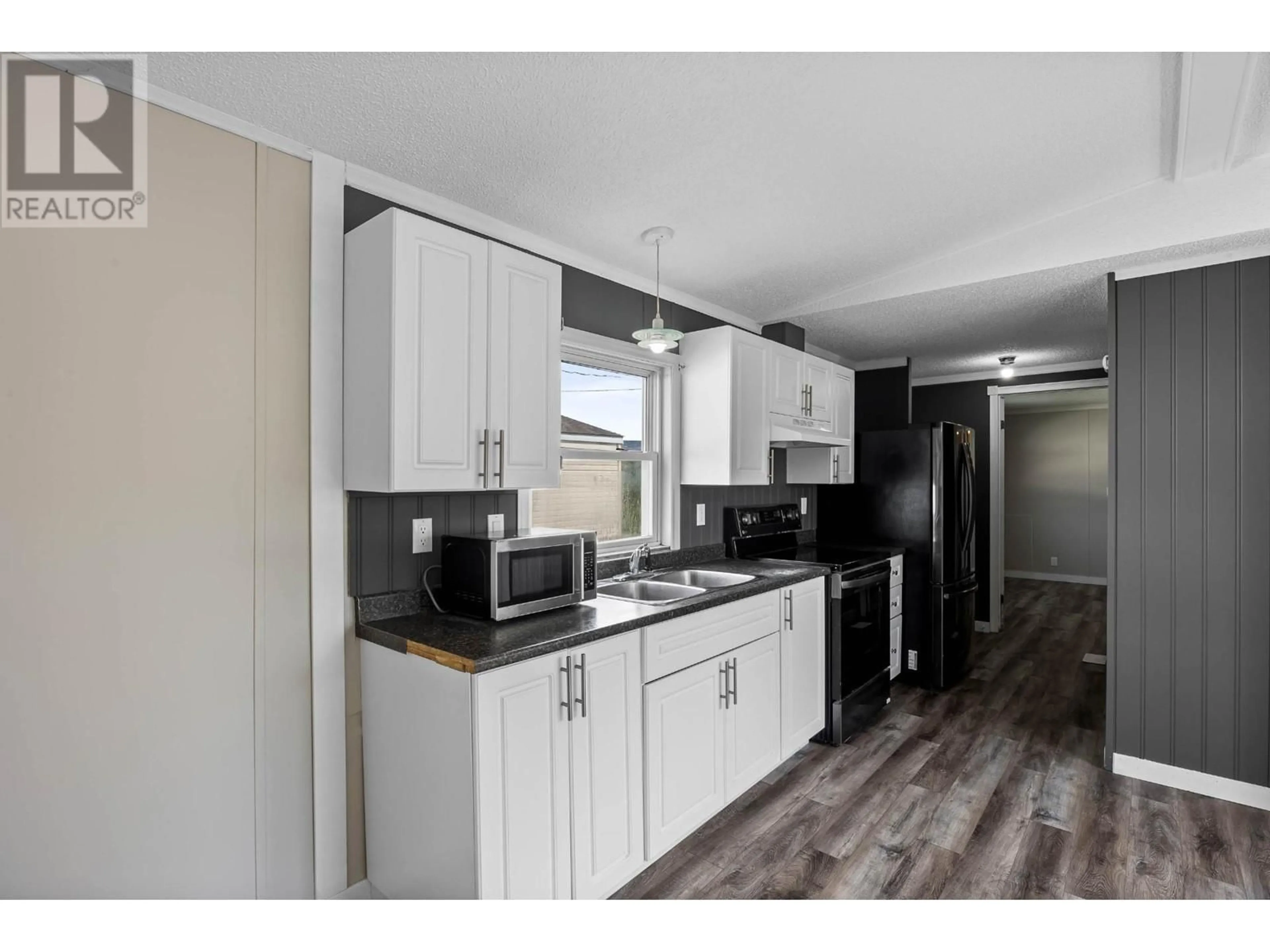 Standard kitchen, wood floors for 1401 NICOLA Avenue Unit# 8, Merritt British Columbia V1K1B8